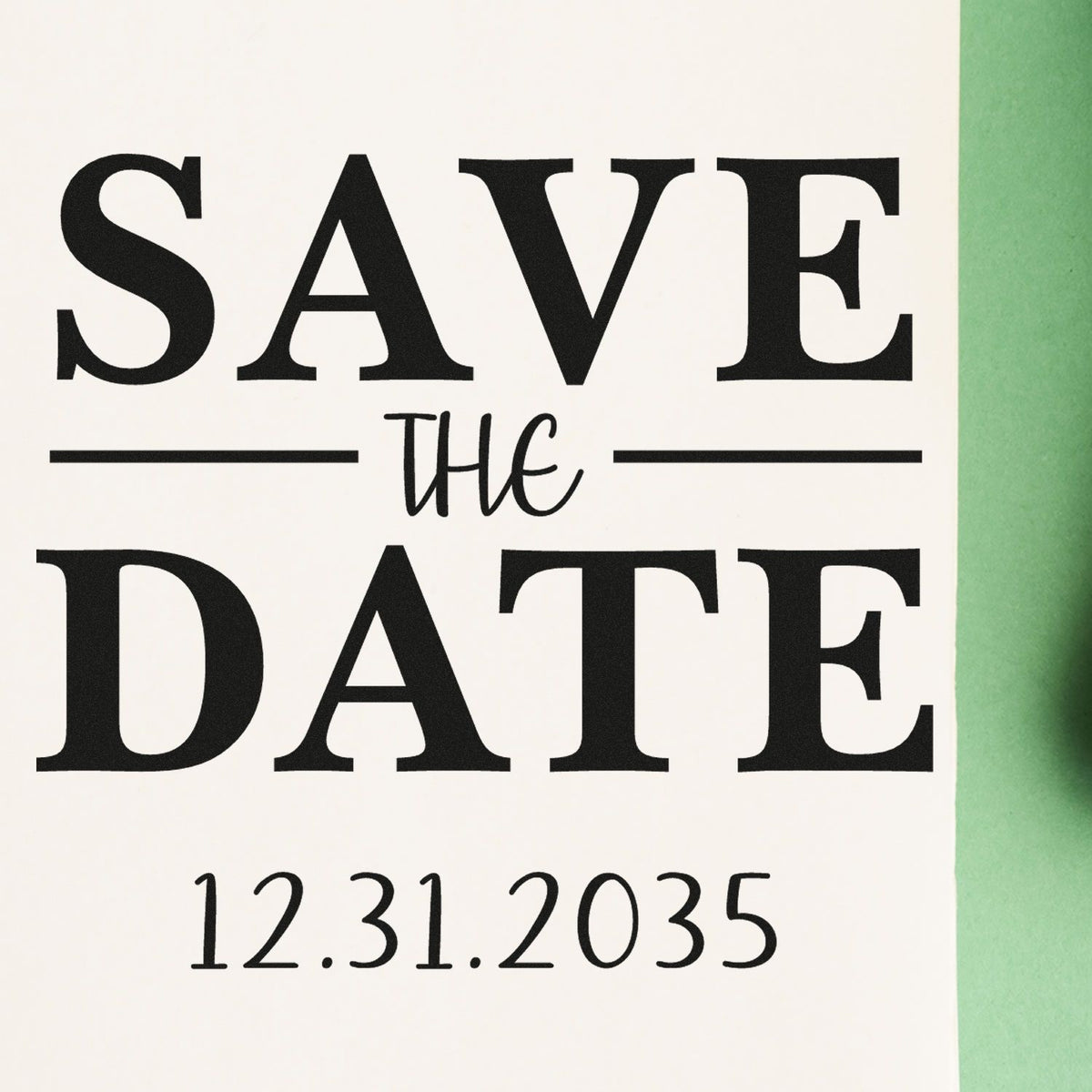 Black save-the-date stamp on white card with green edge, seal-style lettering and date 12.31.2035.