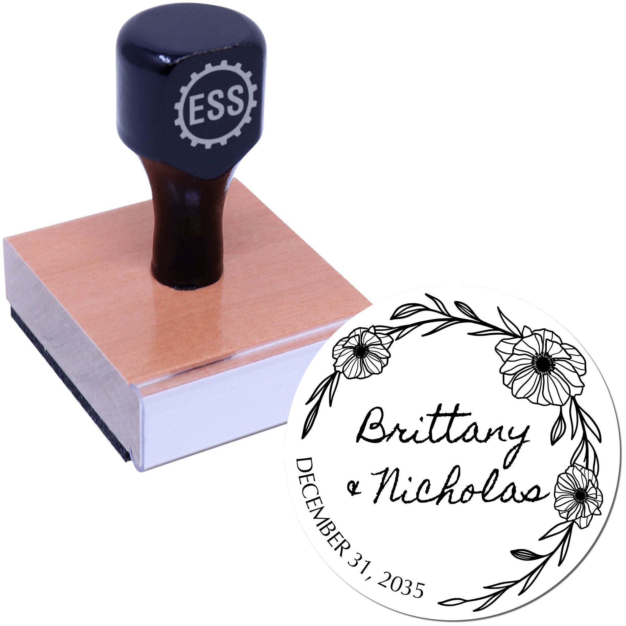 Black ESS custom stamp on wooden block with round white floral wedding seal for Brittany and Nicholas, December 31, 2035.