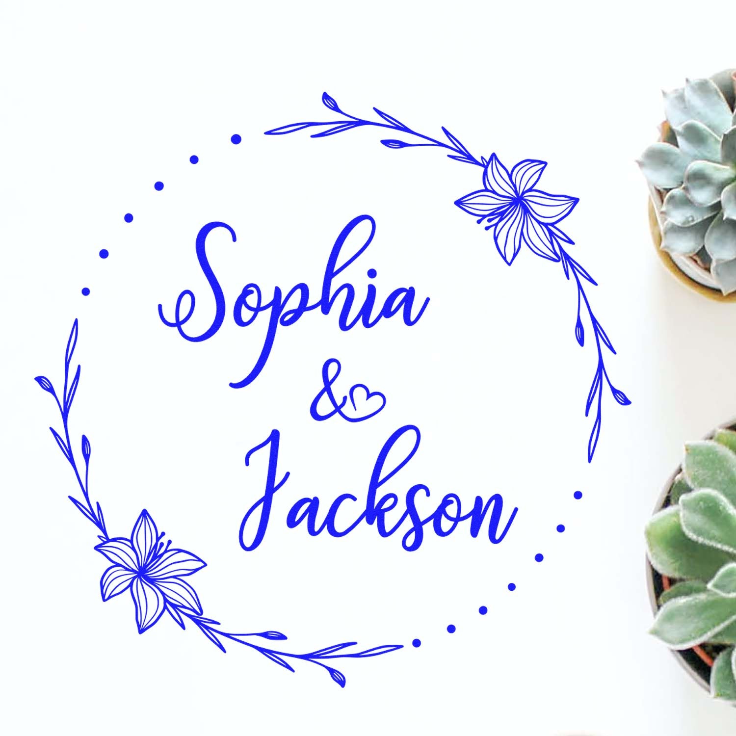 Blue floral custom stamp seal for Sophia & Jackson with dotted wreath and heart accents on white background