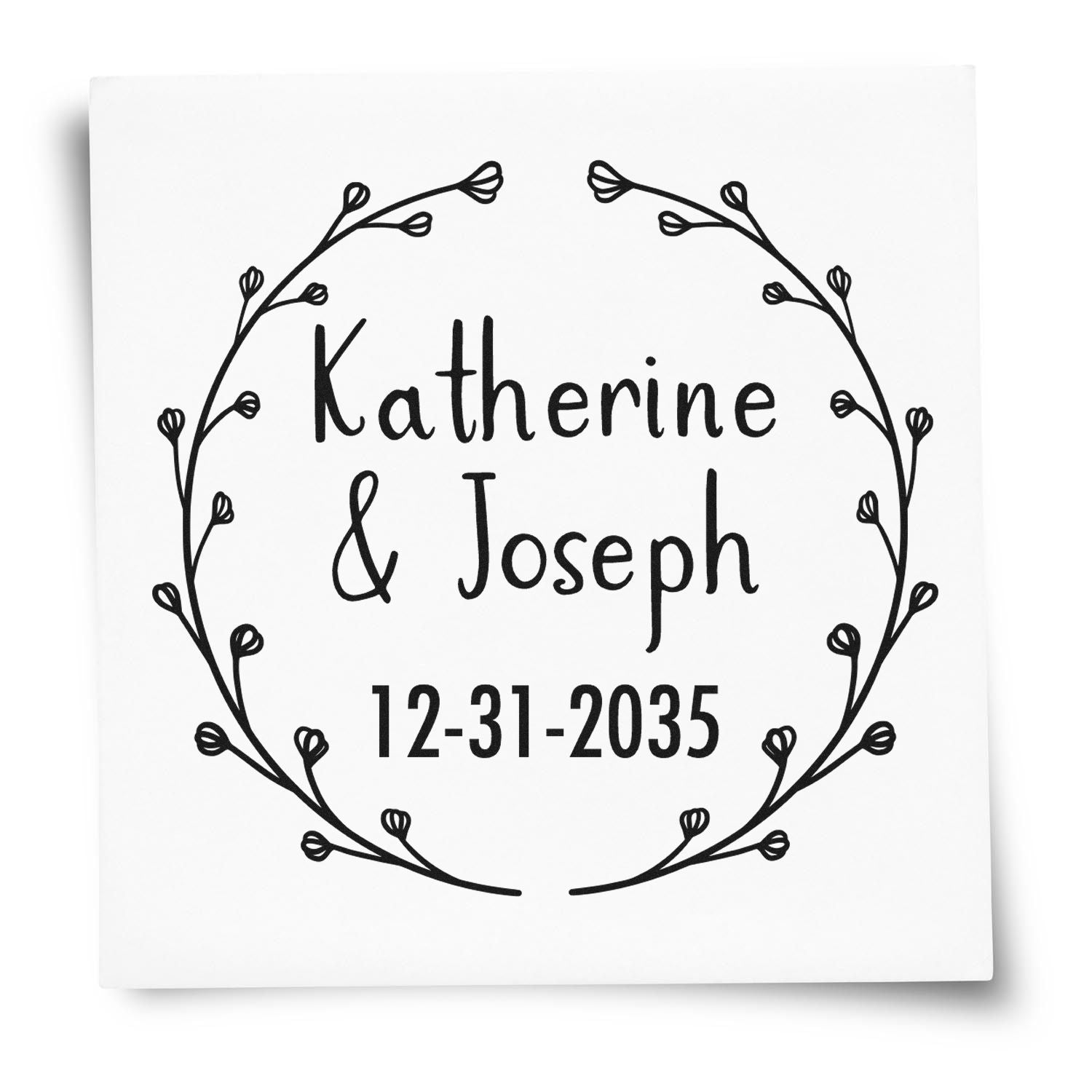 Custom black wedding stamp and seal with floral wreath, Katherine & Joseph, and date 12-31-2035 on a white background.