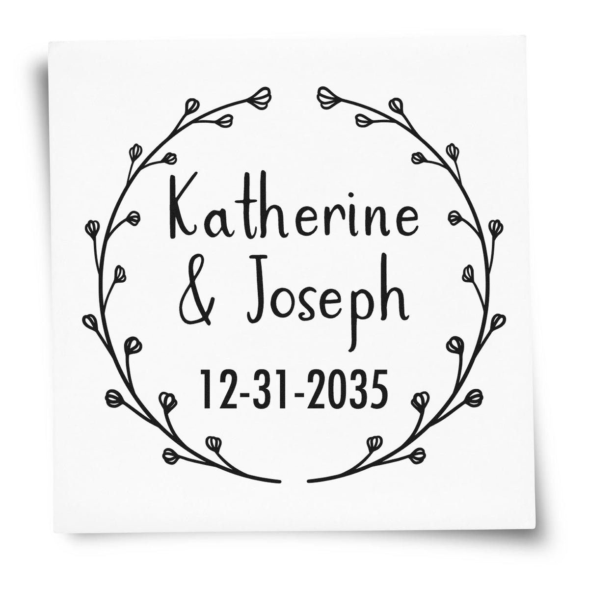 Trodat Blossoming Love personalized wedding address stamp with floral initial design in use on wedding stationery.