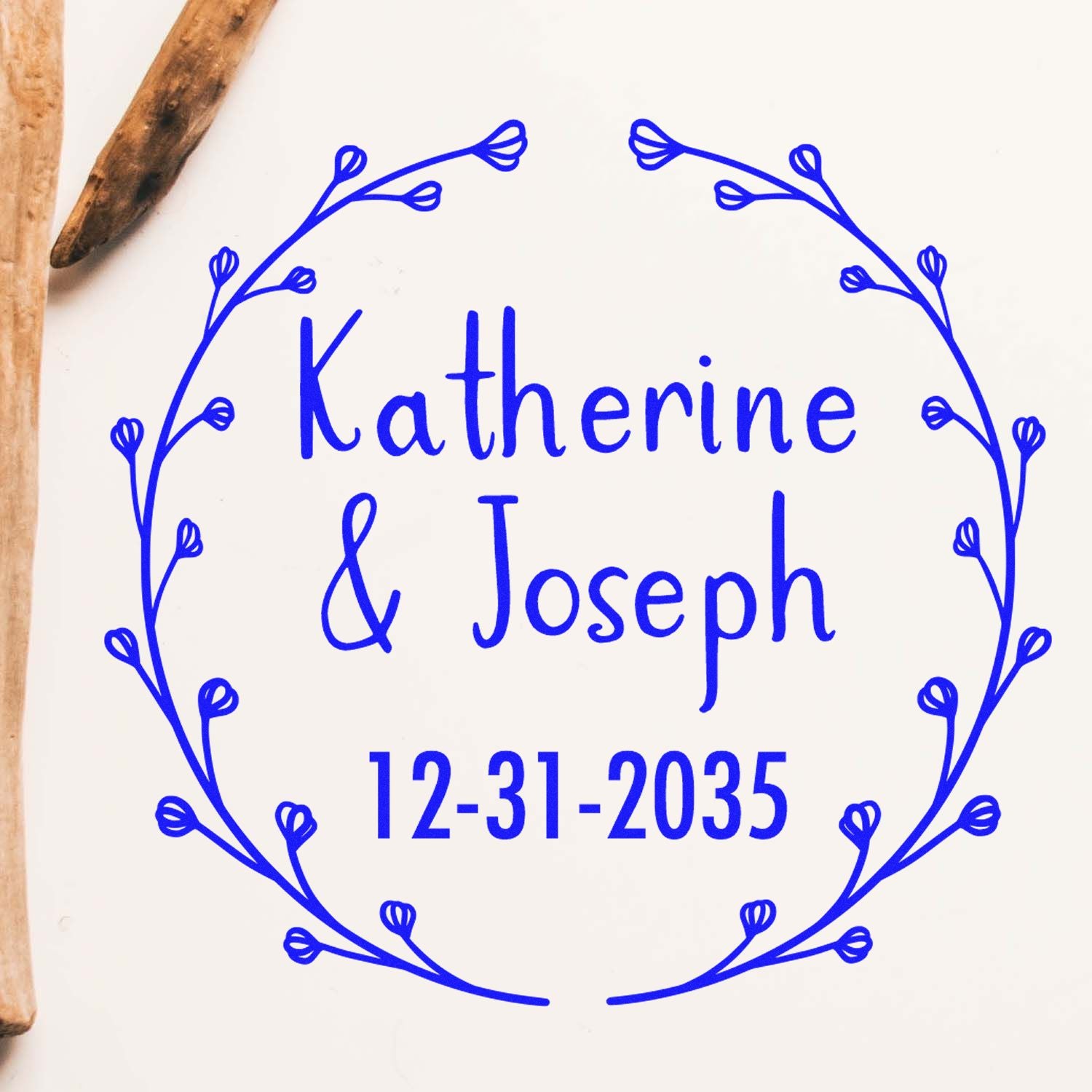 Blue custom wedding stamp with floral wreath, Katherine & Joseph, and 12-31-2035 on white background with wooden seal edges.