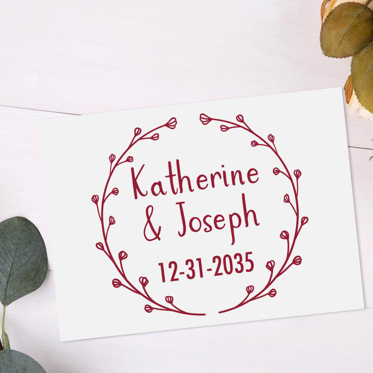 Personalized Trodat Blossoming Love wedding stamp with return address initials in use, featuring floral design on white background.