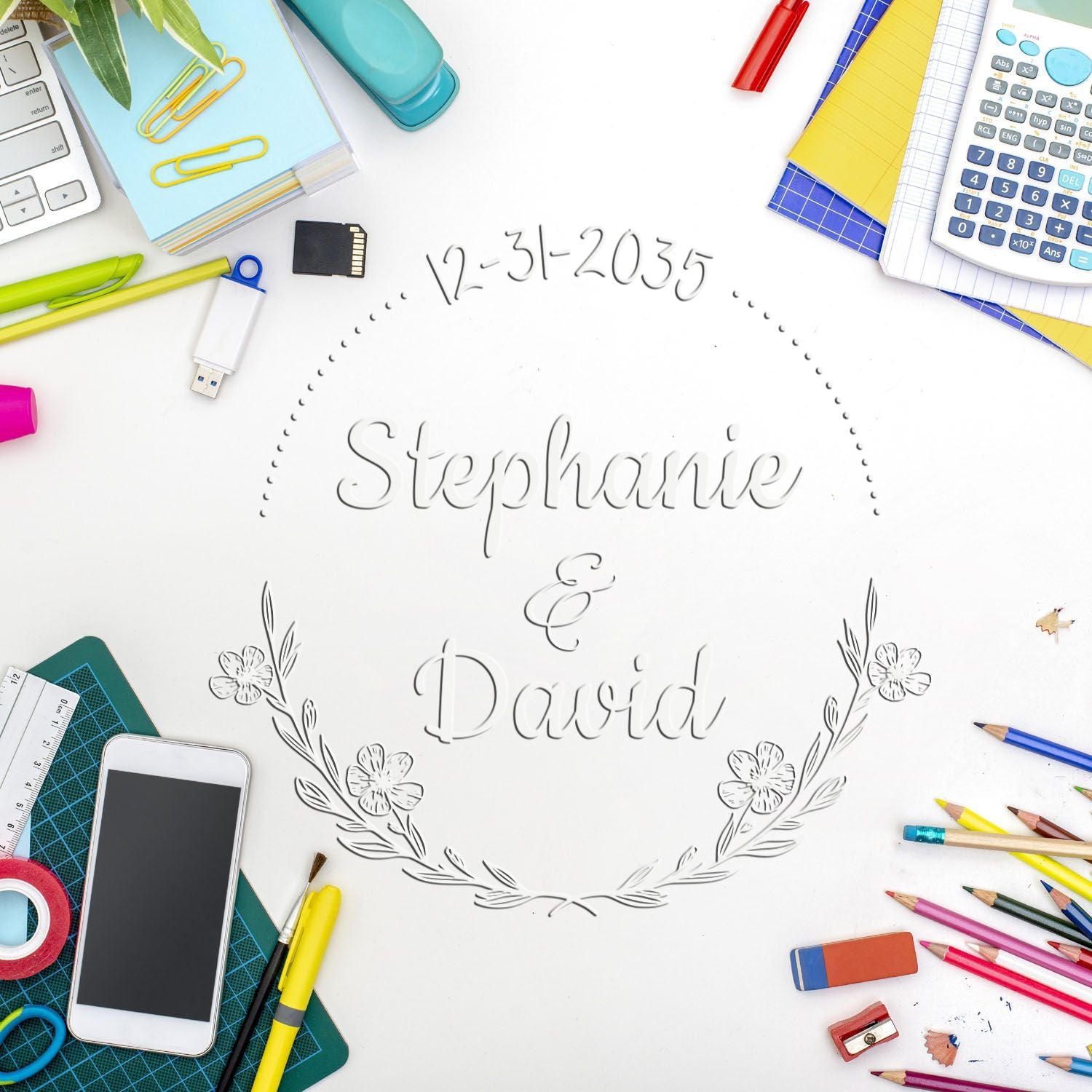 Custom wedding stamp and seal for Stephanie & David with floral wreath, date 12-31-2035, on white, surrounded by colorful stationery.