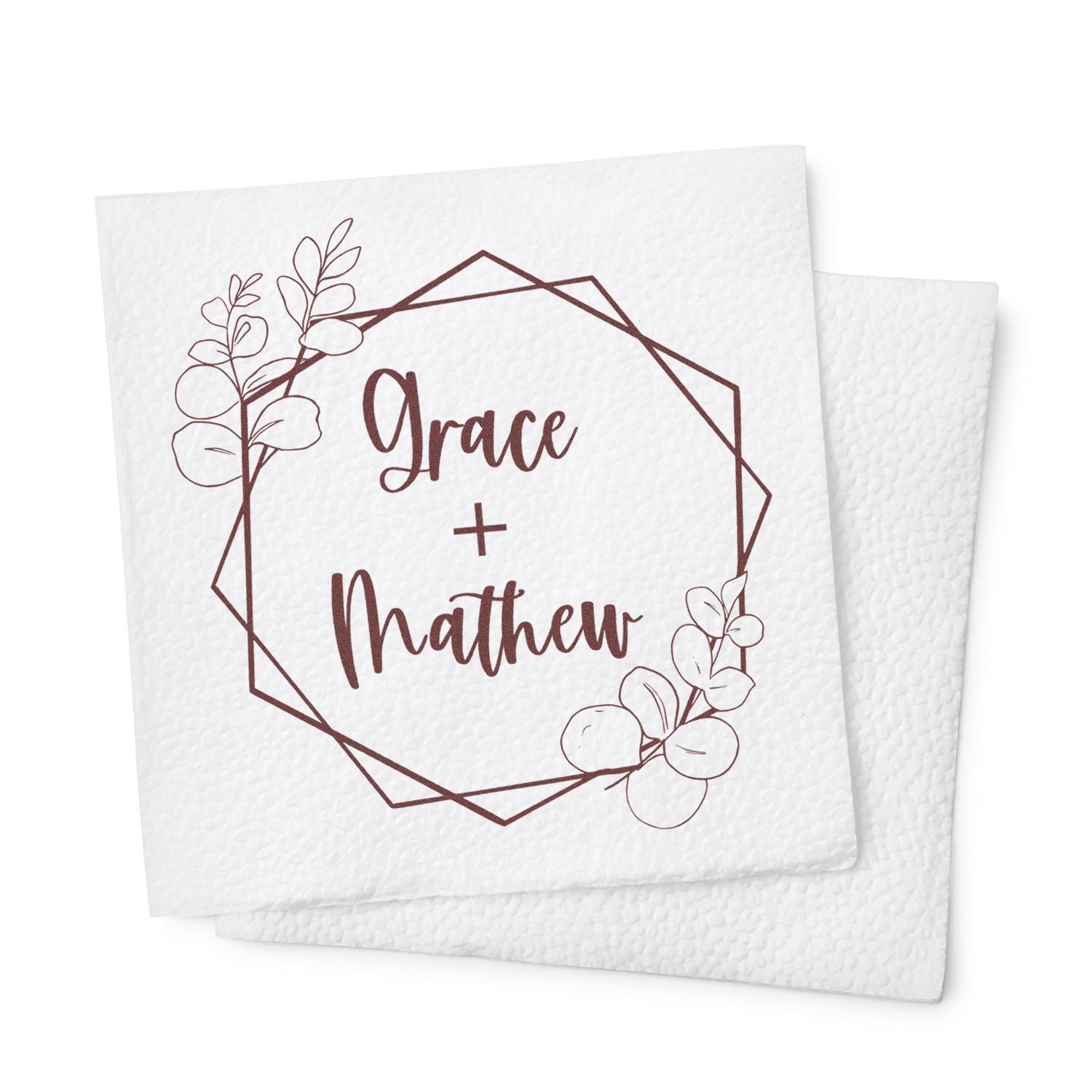 Brown floral wedding stamp seal on white textured card, featuring a geometric frame and names Grace + Matthew.