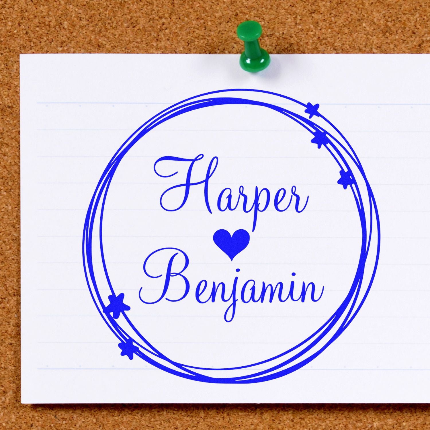 Custom blue Harper Benjamin stamp and seal with heart and stars on white paper, pinned to corkboard.