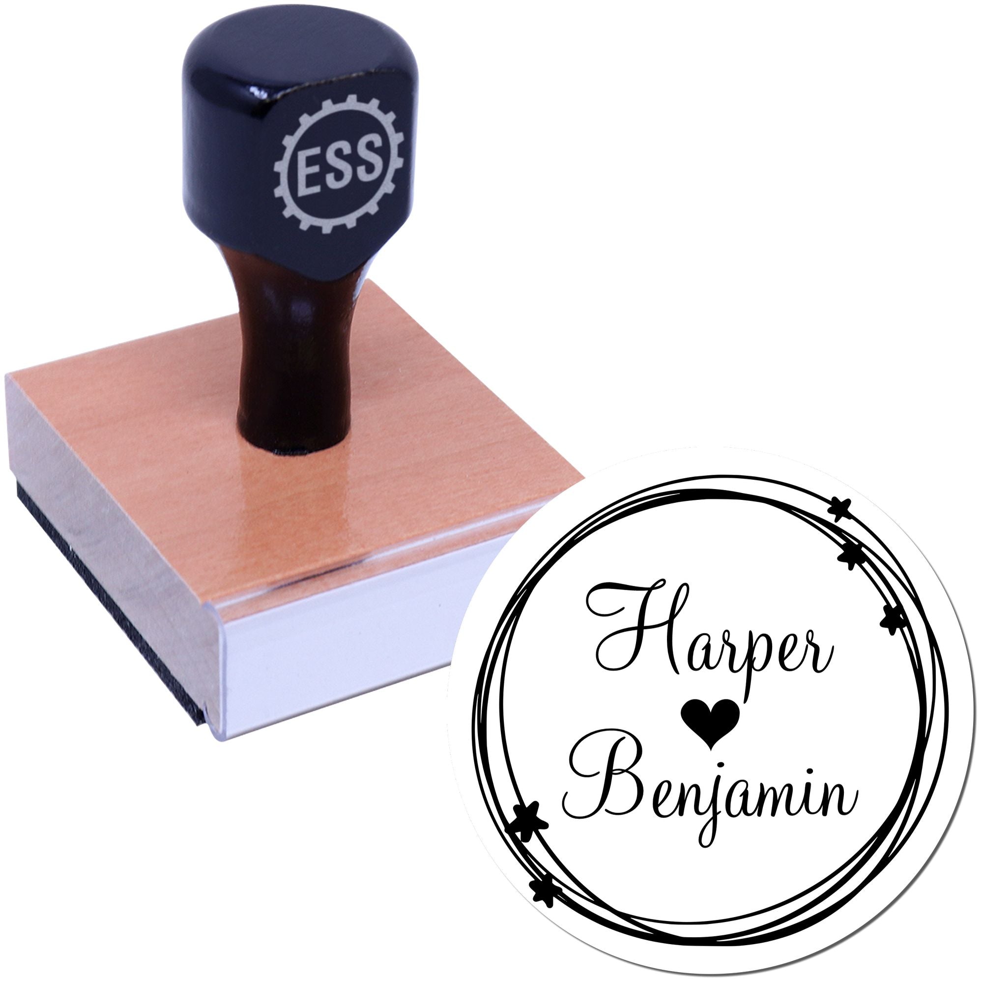 Dark blue custom stamp and round seal with Harper Benjamin, heart and stars on a wooden block.