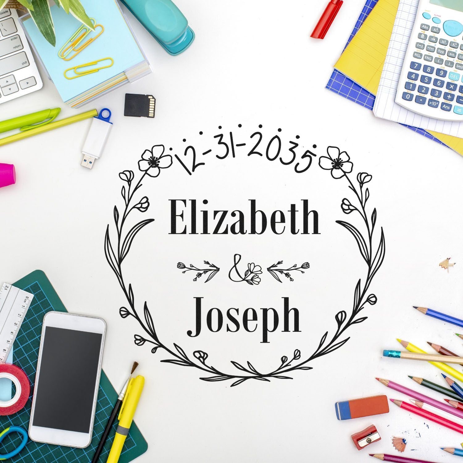 Black floral custom stamp seal for Elizabeth and Joseph, framed by colorful office supplies on a white background.