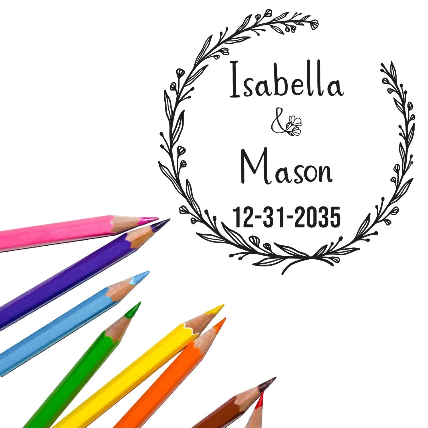 Custom black floral wreath stamp seal with Isabella, Mason, 12-31-2035, plus colorful pencils.