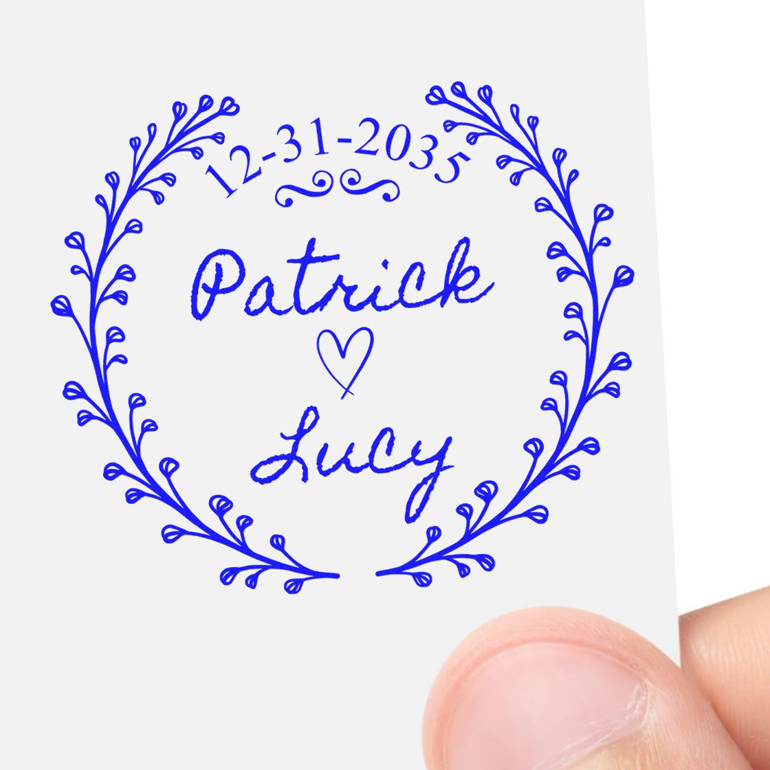 Blue custom wedding stamp seal with laurel wreath, date 12-31-2035, Patrick and Lucy names, and a heart.