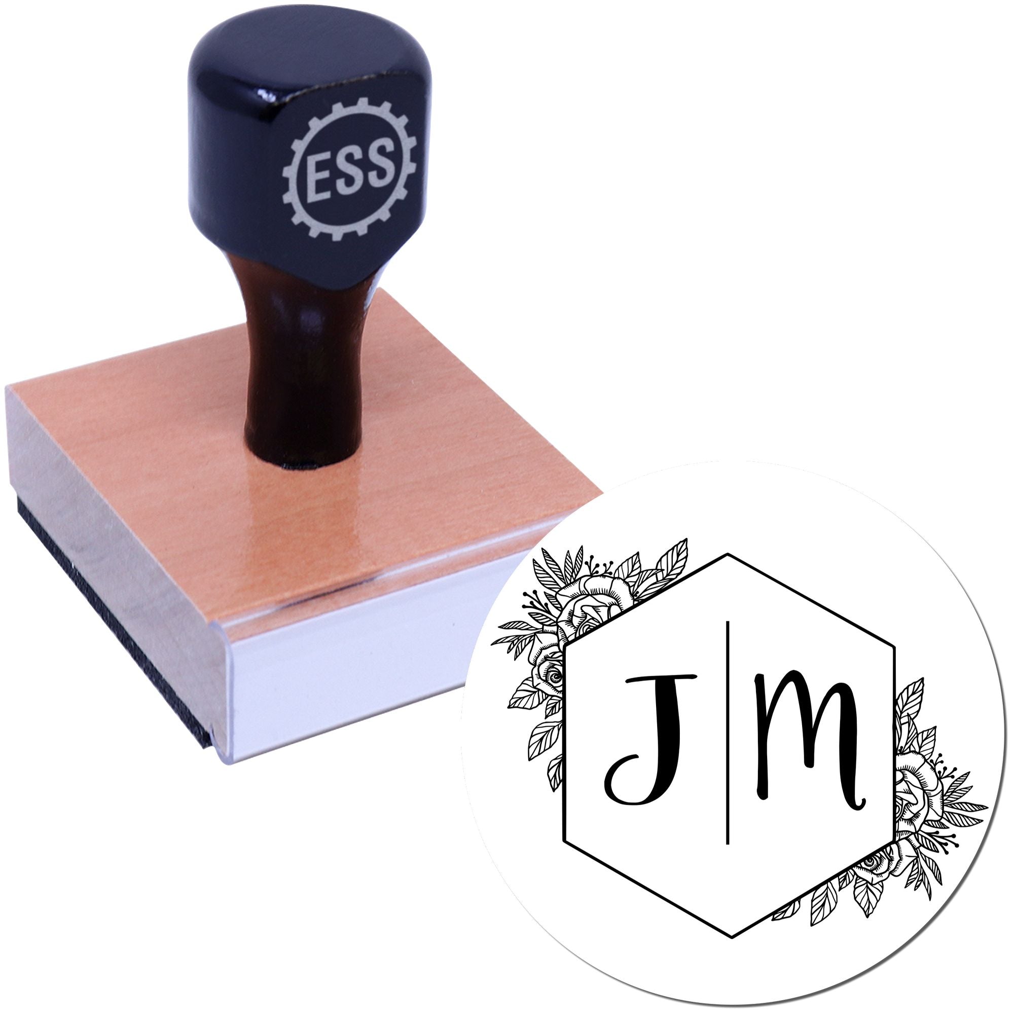 Black custom stamp and seal on a wood block, with ESS logo and floral JM hexagon seal design on white background.