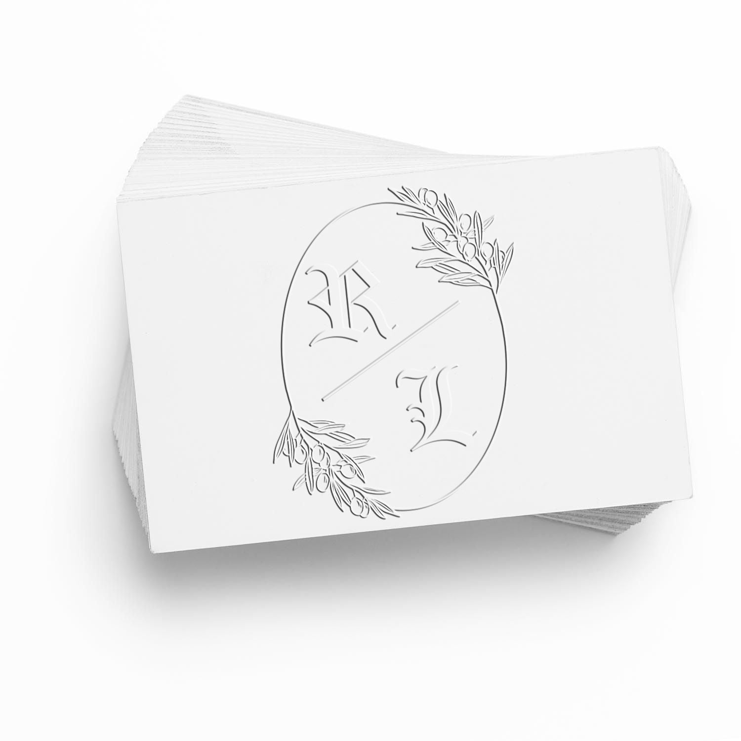 White embossed stamp and seal cards with R and J monogram, oval floral seal, and olive branch accents.
