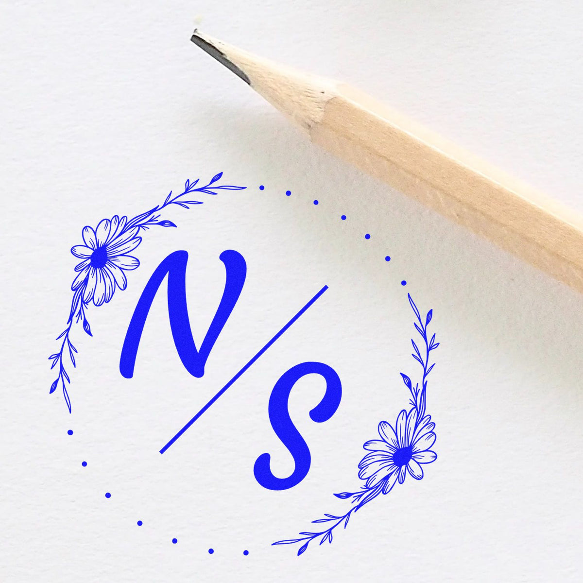 ESS Round Flowered Initials Bliss handmade wedding stamp in use, featuring floral design with initials for couples' stationery.