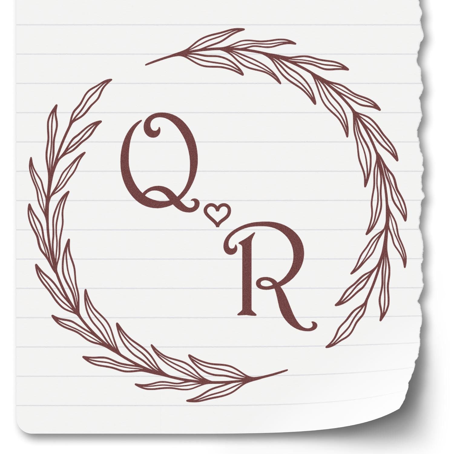 Brown Q?R monogram stamp seal with leafy wreath on white lined paper
