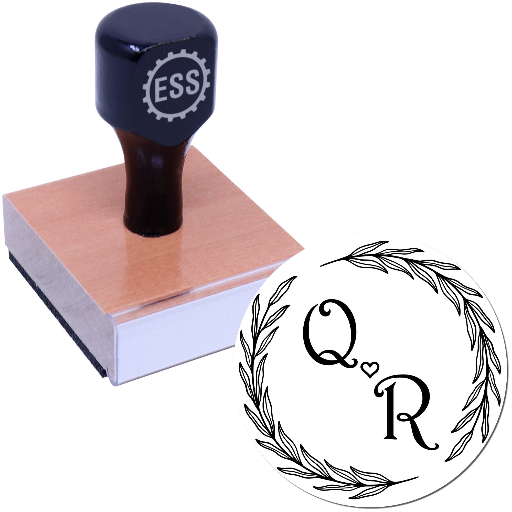 Navy custom self-inking stamp on wooden block with circular floral Q-heart-R seal design.