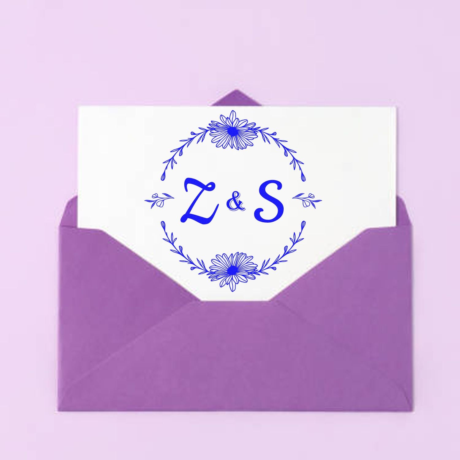 Purple envelope with white card, blue floral Z&S stamp seal design