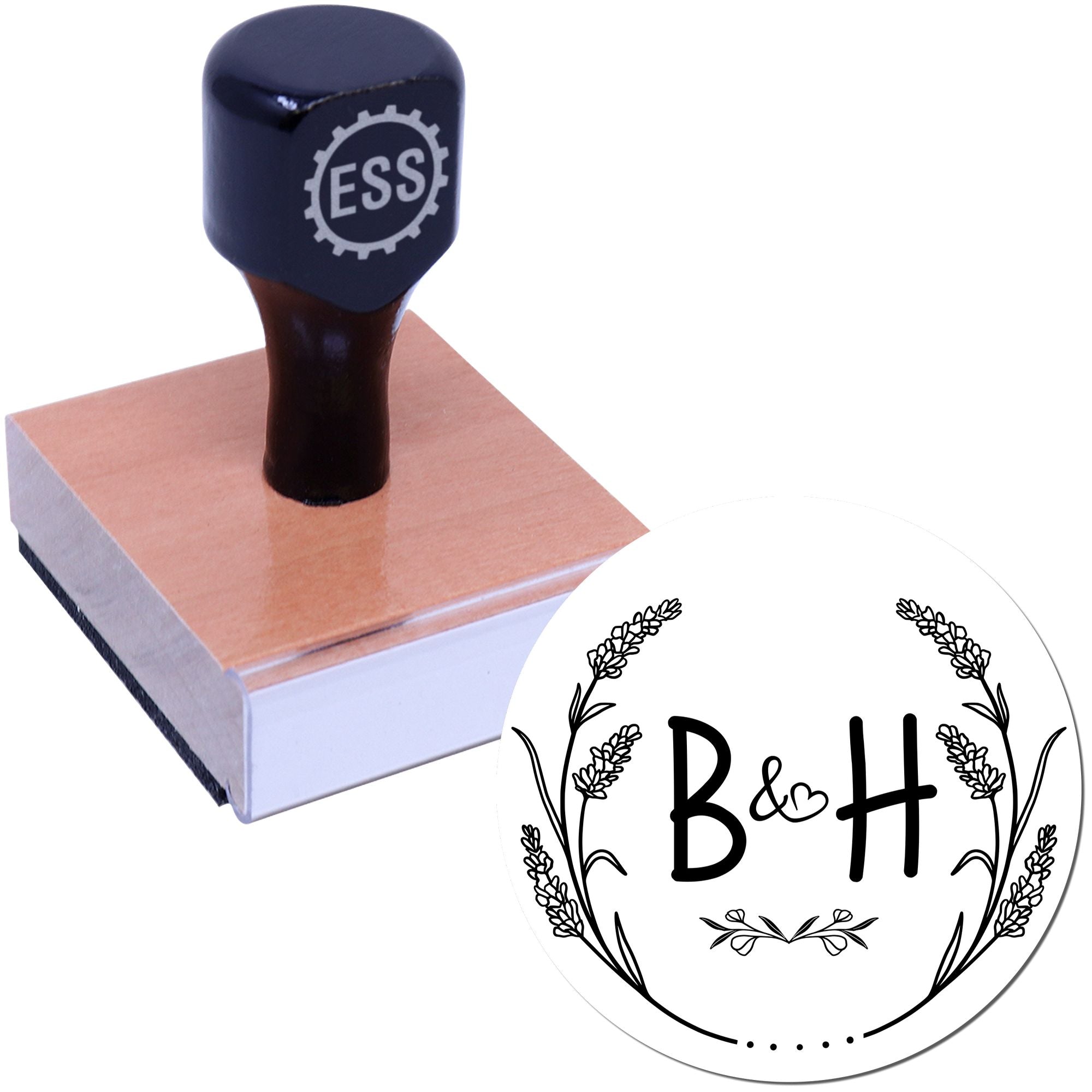 Dark navy custom stamp on wooden base with ESS logo and round black-and-white B&H floral seal design.