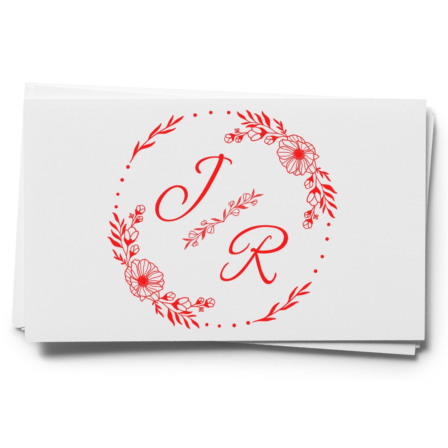 Red floral monogram J R stamp and seal on white cards with decorative wreath and dots.