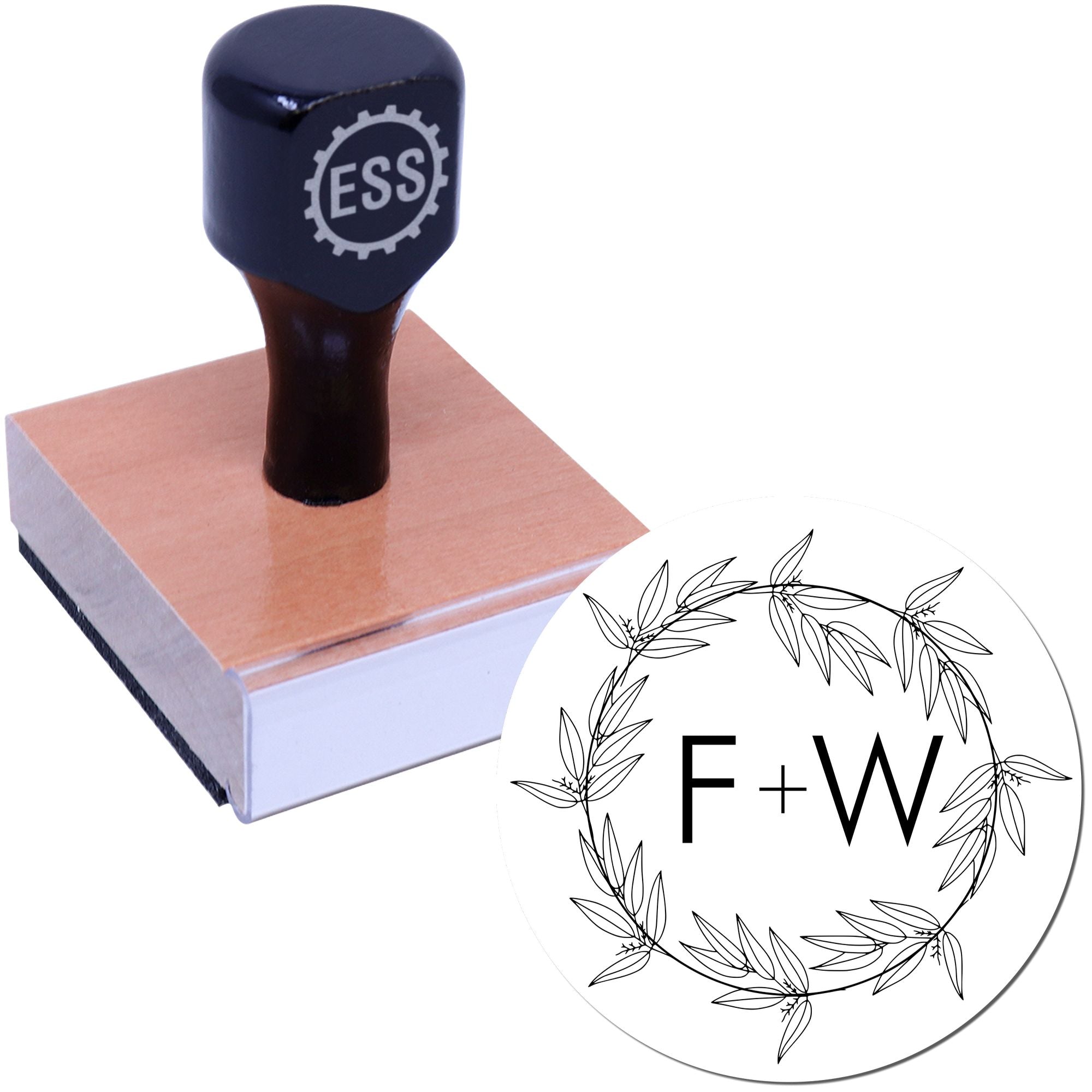 Black ESS stamp on wooden block with matching circular F+W leaf wreath seal