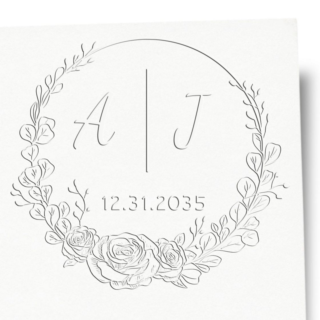 White embossed floral stamp seal with monogram A | J, leafy wreath, roses, and date 12.31.2035 on a white background.