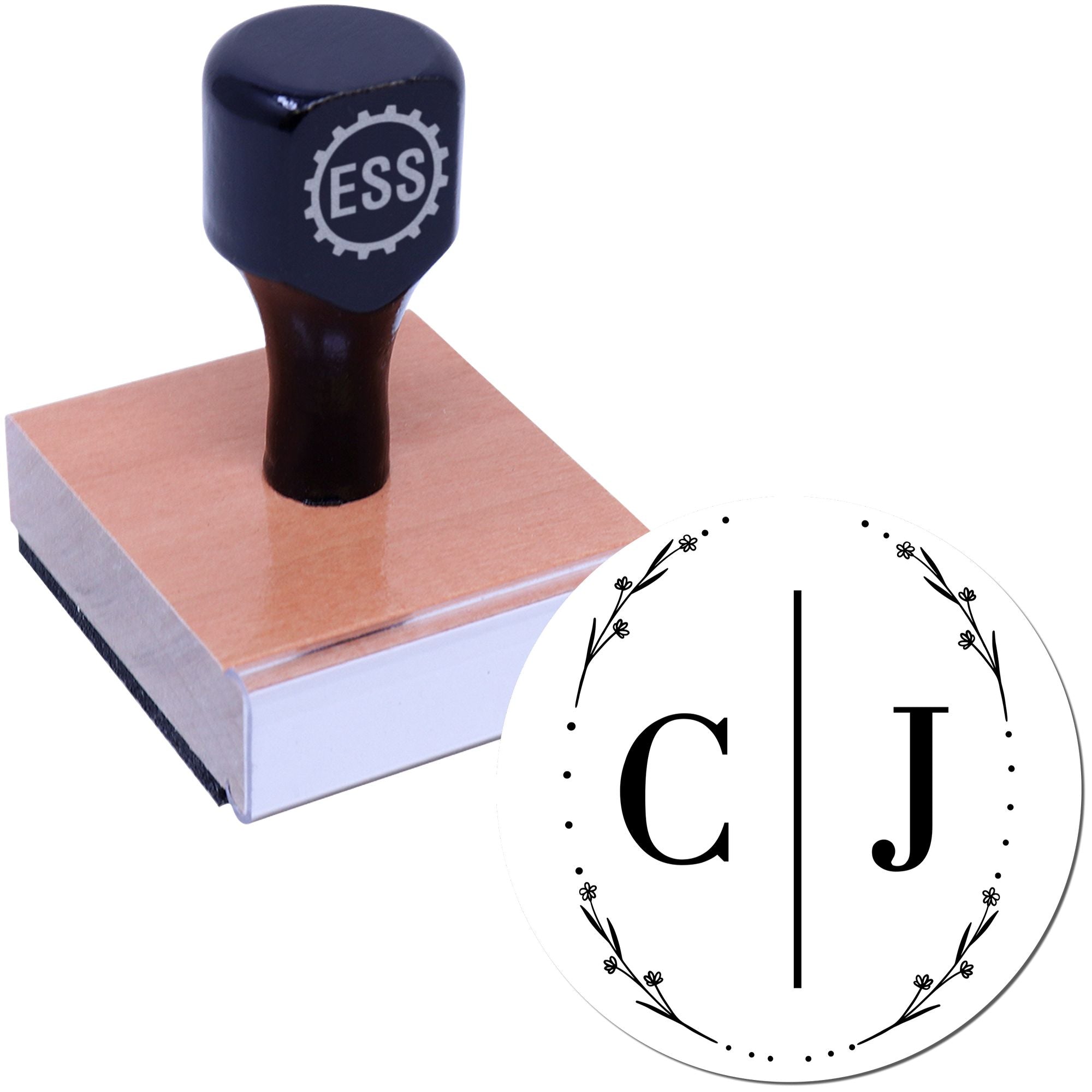 Black custom stamp and circular seal with CJ monogram, floral wreath border, on a copper-colored block against a white background.