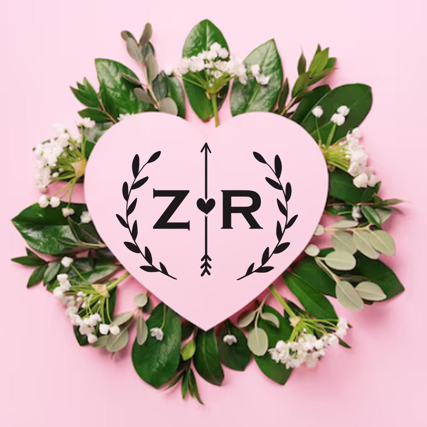 Pink heart stamp seal with black ZR logo and arrow, framed by green leaves and white flowers on a pink background.