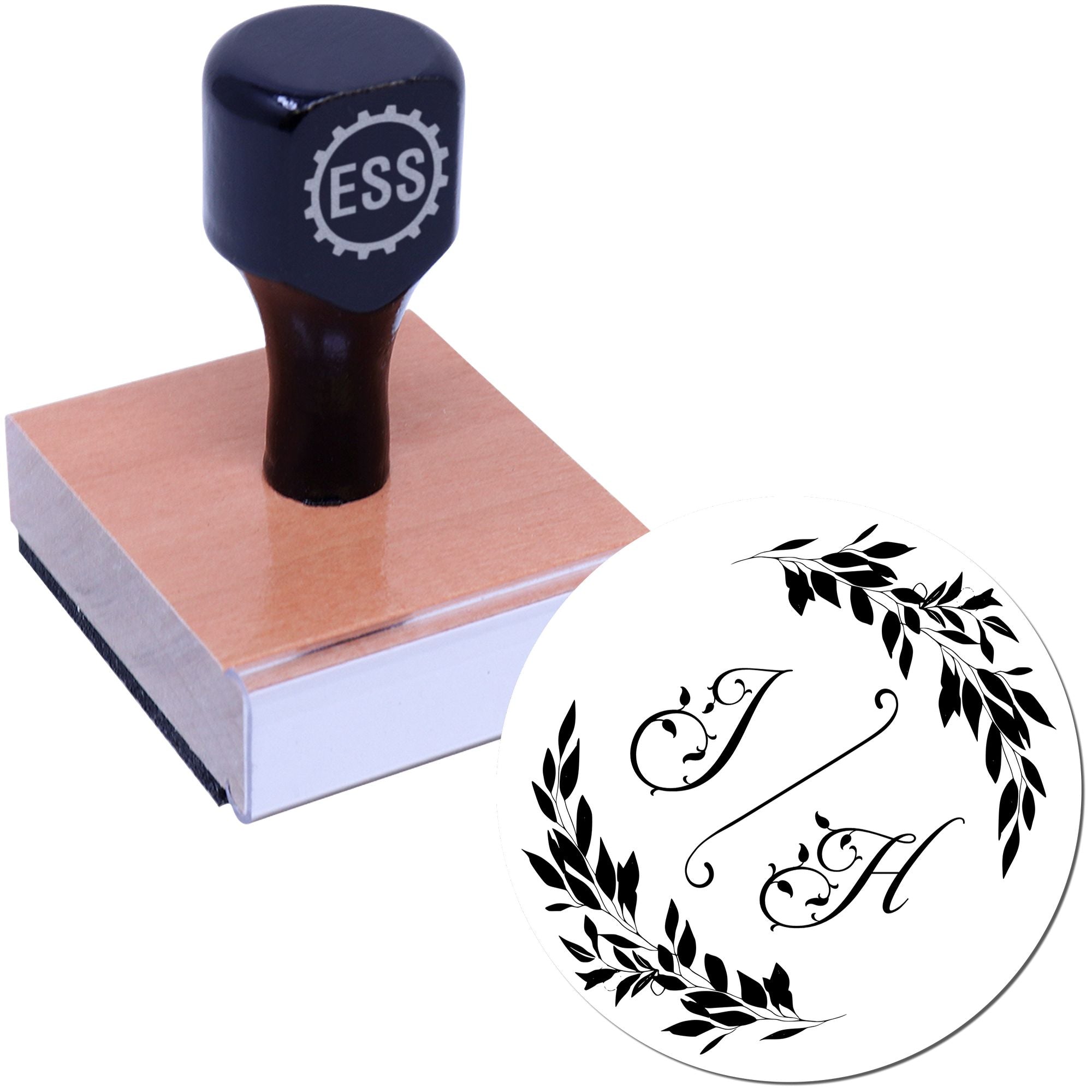 Black custom stamp and round seal with ornate J and H, black leafy wreath design on white background.