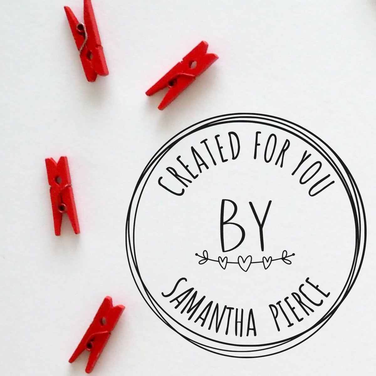 Round handcrafted love rubber stamp by ESS, featuring a custom design, shown in use on paper.