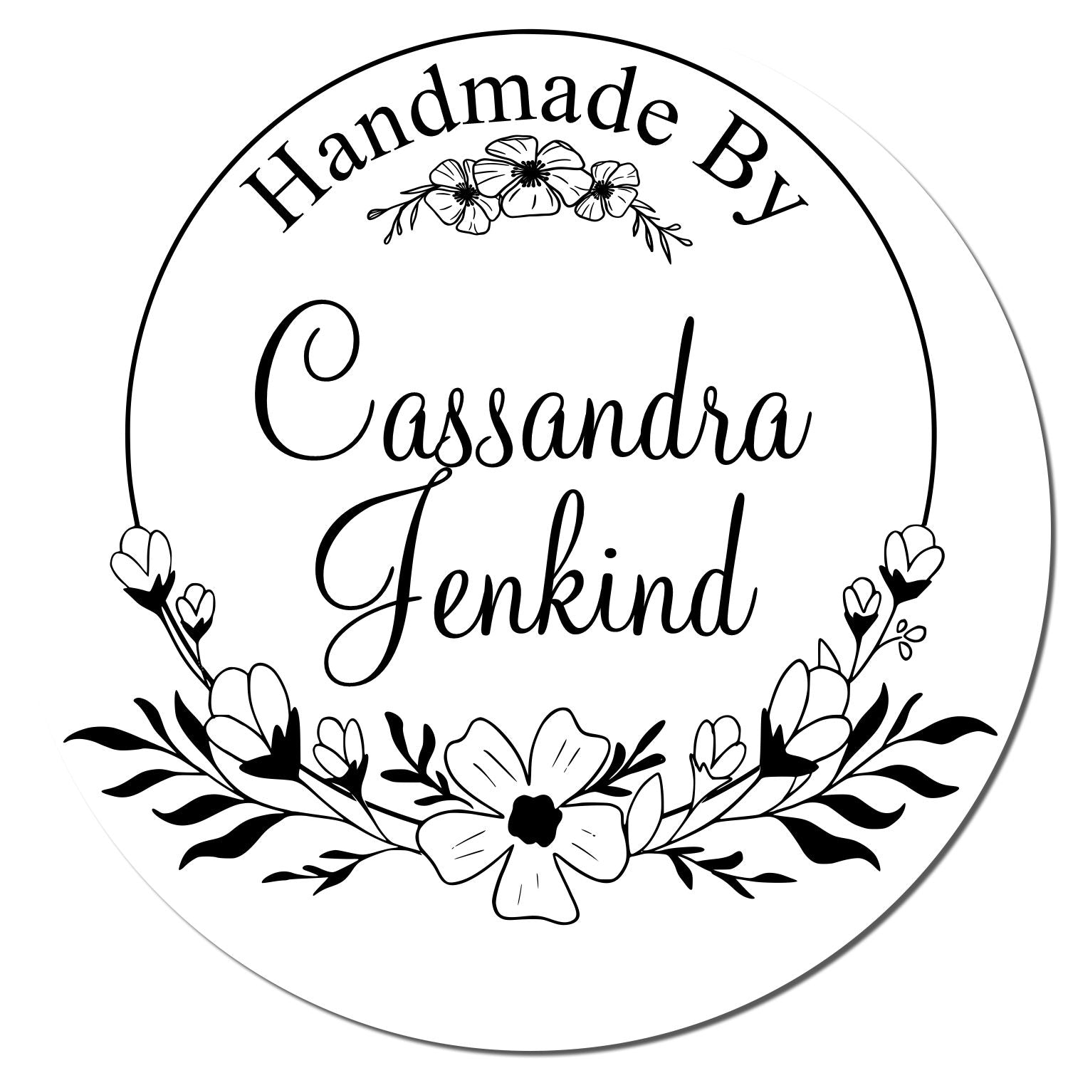 Black-and-white round handmade stamp seal with floral wreath and Cassandra Jenkind.