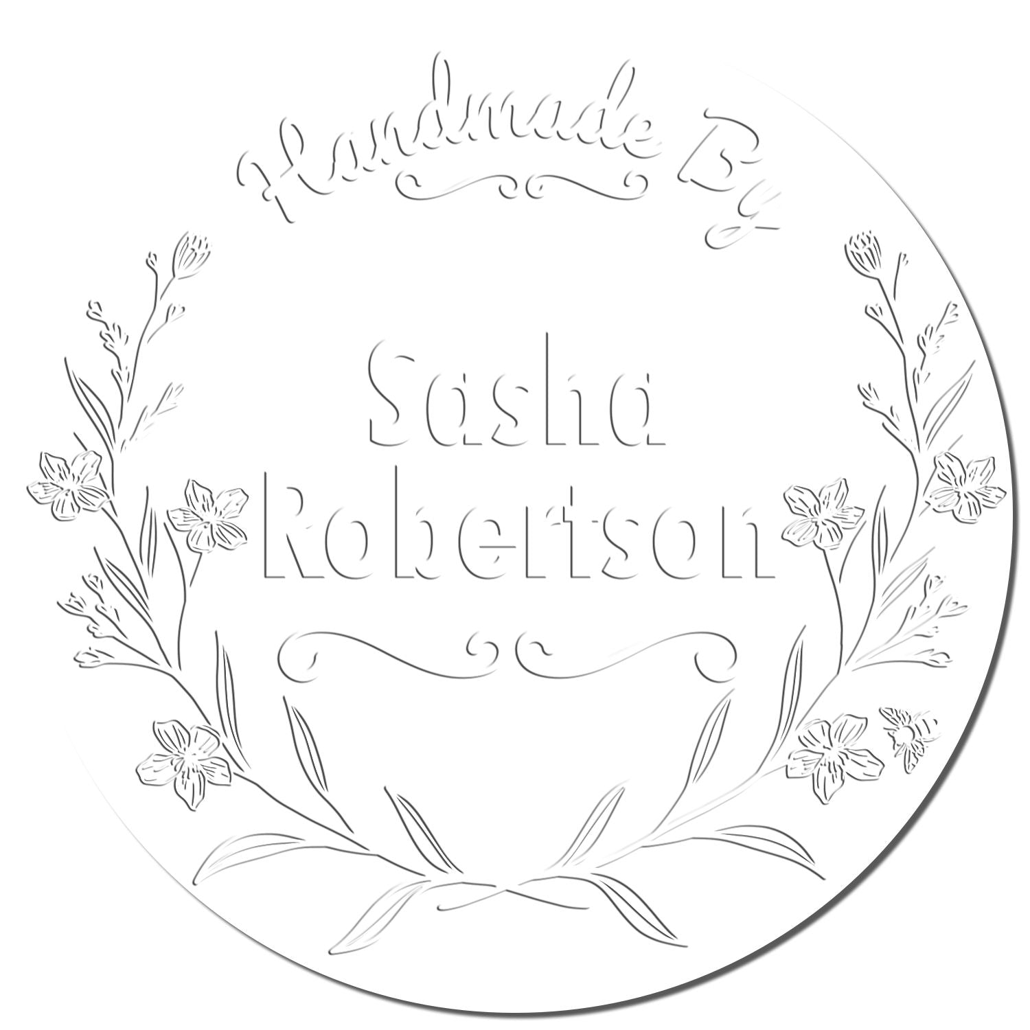 Round white floral custom stamp seal with engraved script text, Handmade by Sasha Robertson, and delicate botanical border.