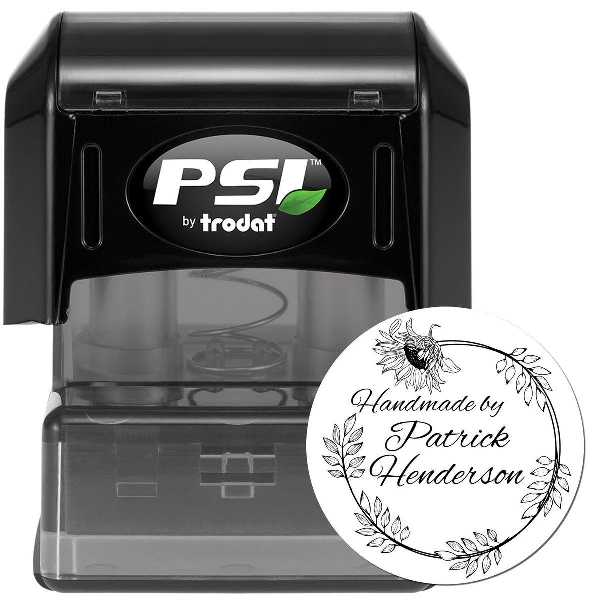 Black PSI by Trodat self-inking stamp with clear custom round seal reading Handmade by Patrick Henderson, floral wreath design.
