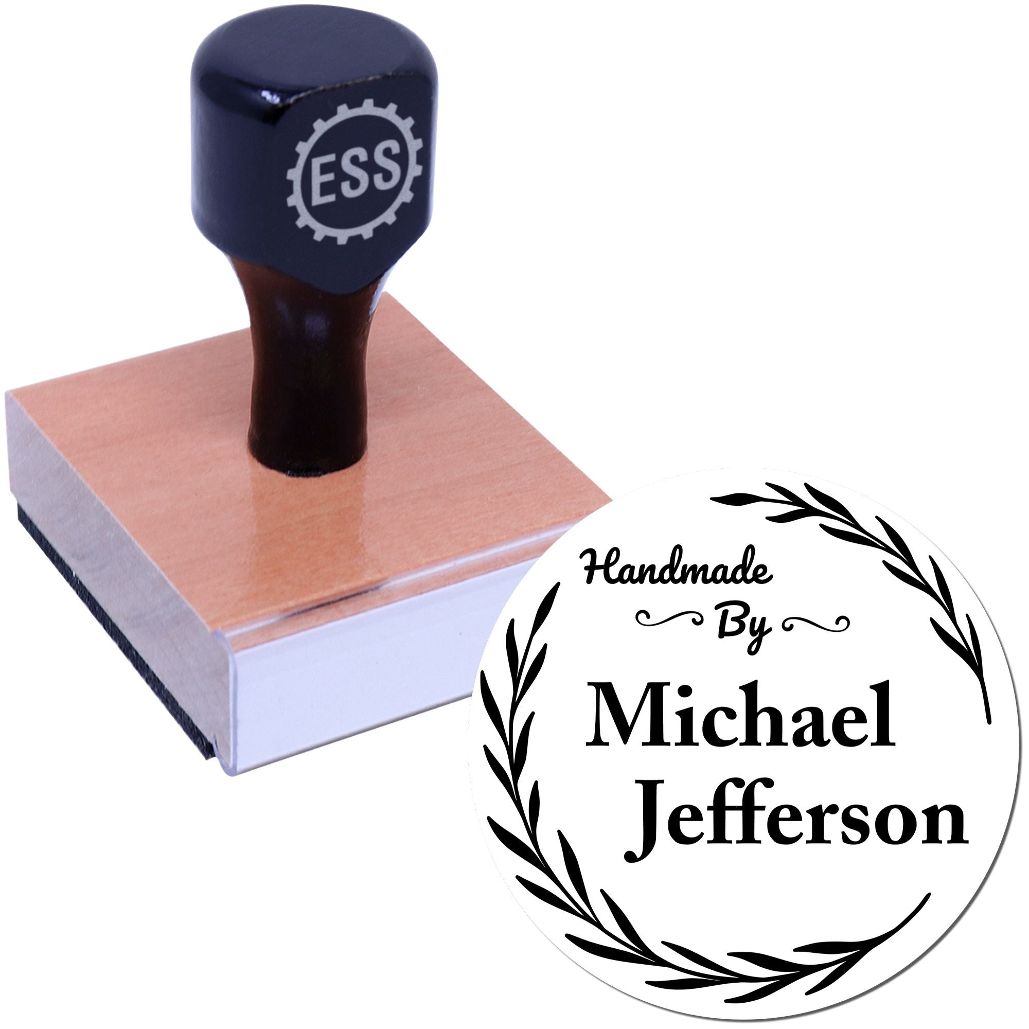 Dark navy custom stamp on a wooden block beside a white circular seal with black wreath and Handmade By Michael Jefferson text