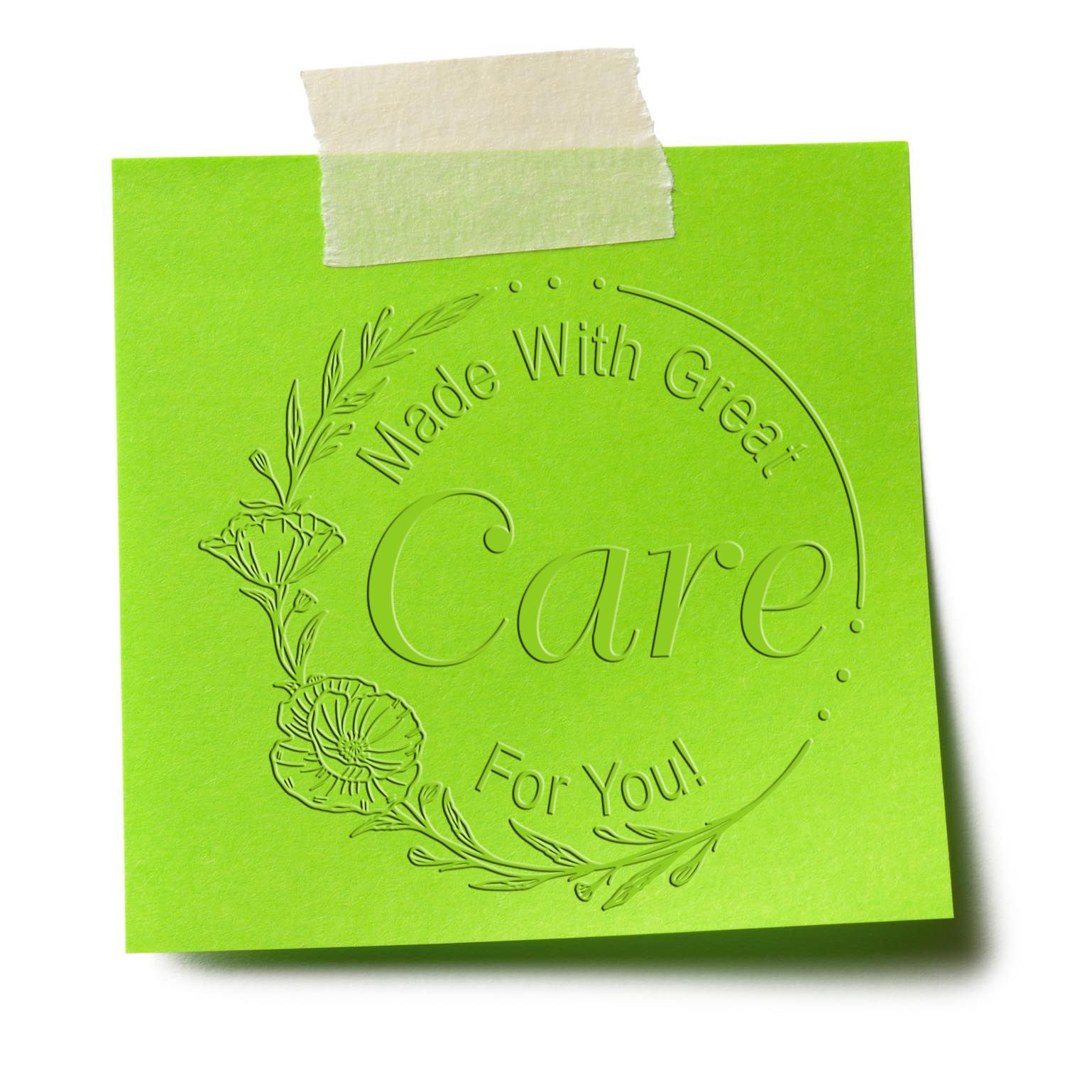 Bright green embossed stamp seal card reading Made With Great Care! For You! with floral wreath and masking tape
