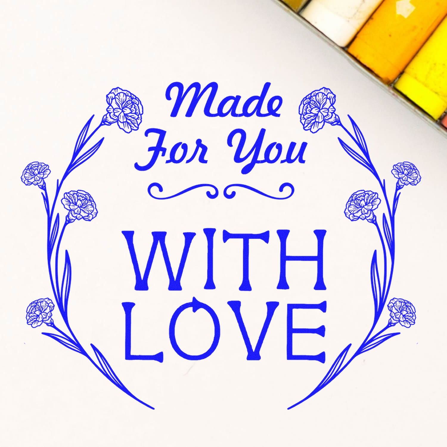 Blue floral stamp seal reading Made For You With Love on a white background, with ornate flower border.