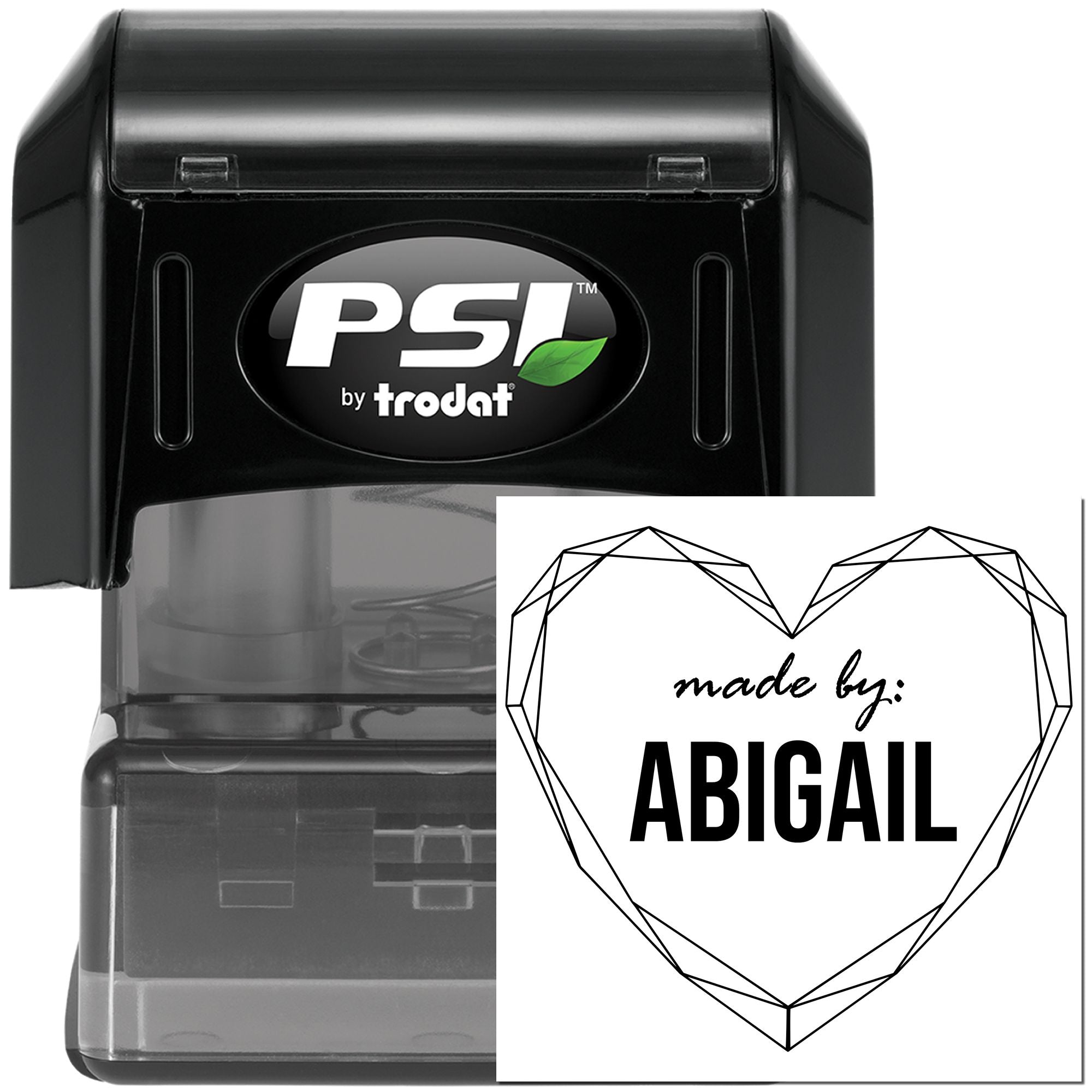 Black PSI by Trodat self-inking stamp with translucent gray base and custom heart seal reading made by: ABIGAIL in black.