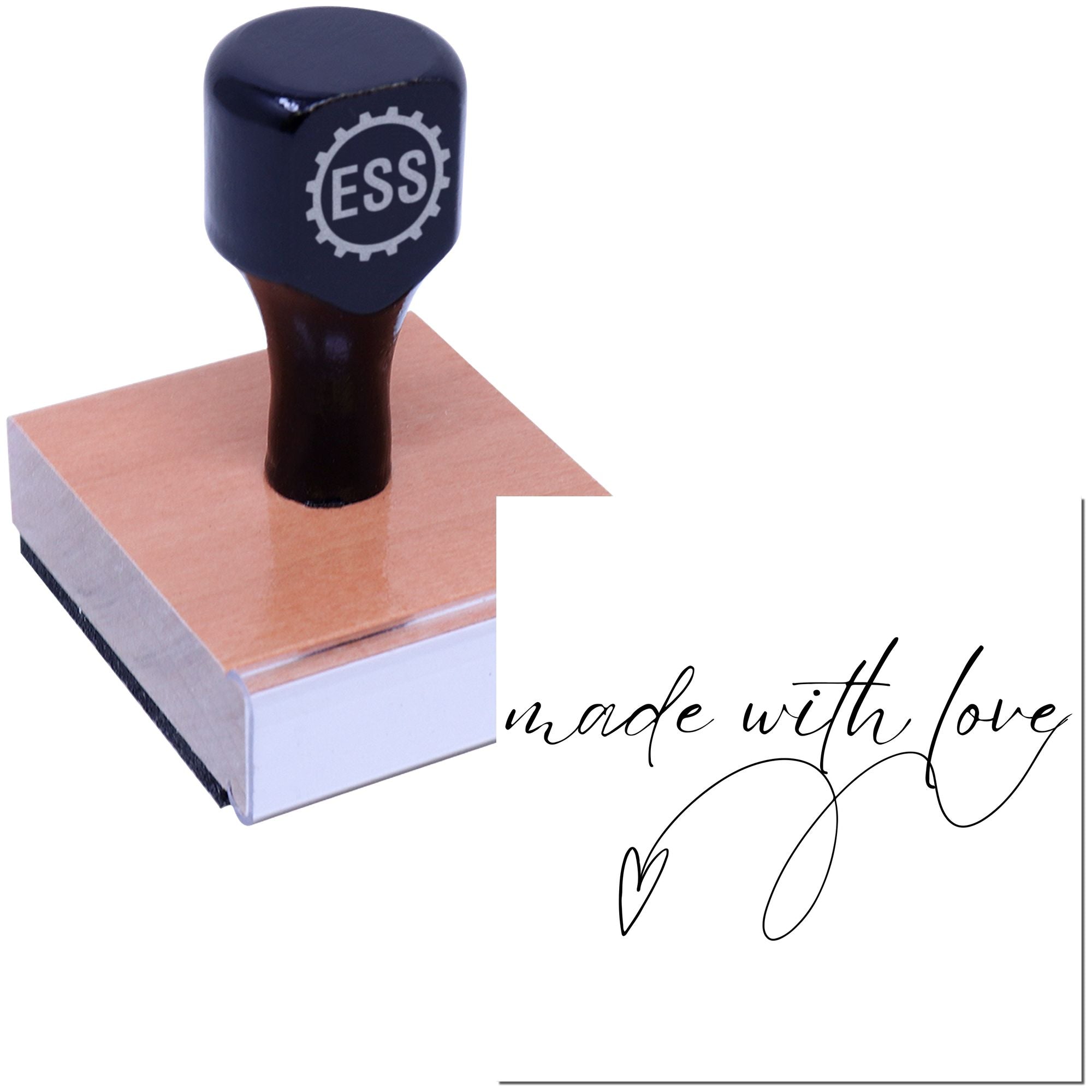 Black ESS stamp and seal on a pink wood block with made with love script and heart graphic.