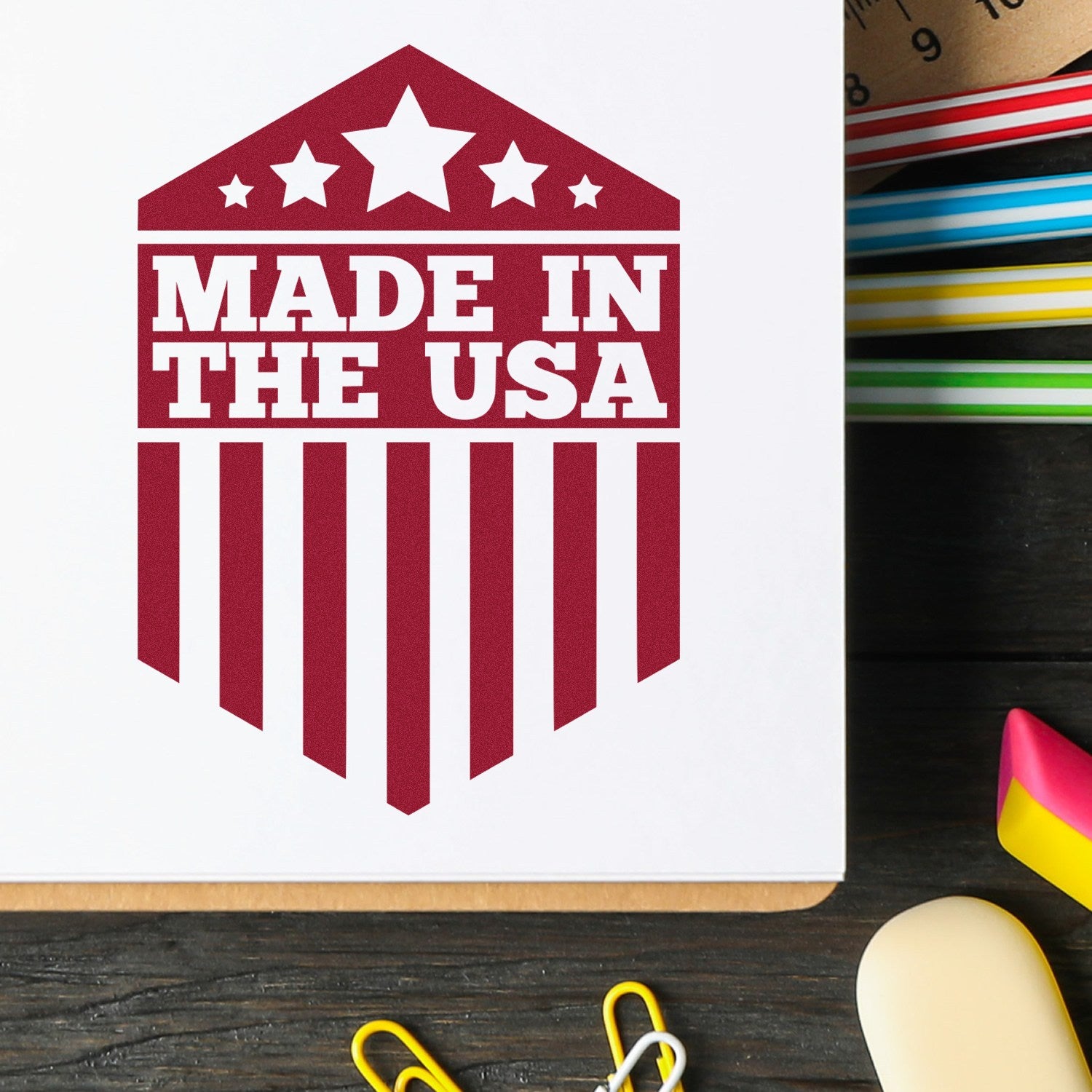ESS Wood Handle Patriotic Pride Seal rubber stamp in use, featuring a patriotic design for stamping projects.