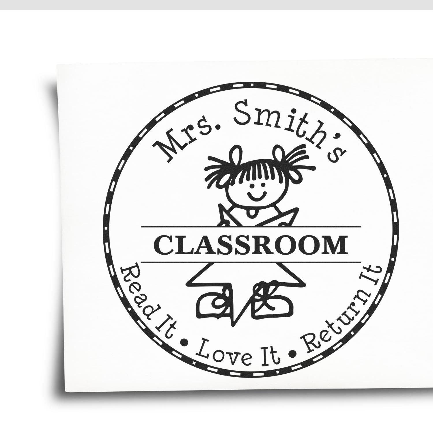 Black circular classroom stamp seal with girl reading and text: Mrs. Smiths Classroom, Read It, Love It, Return It