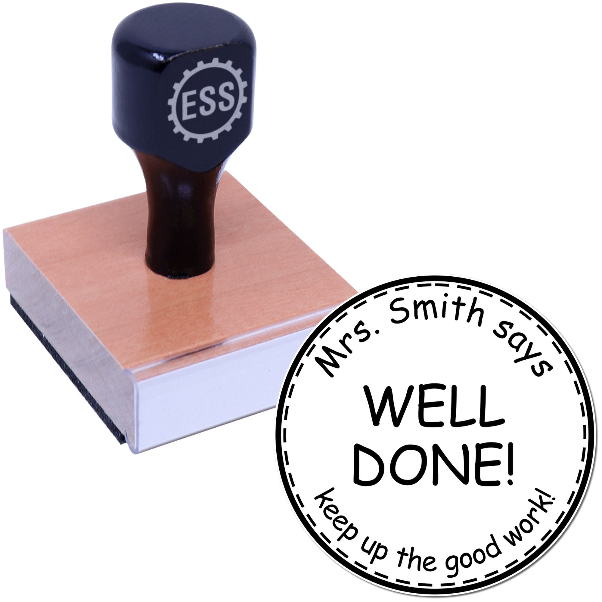 Dark blue ESS rubber stamp on a book beside a black-and-white circular teacher seal reading Mrs. Smith says WELL DONE!
