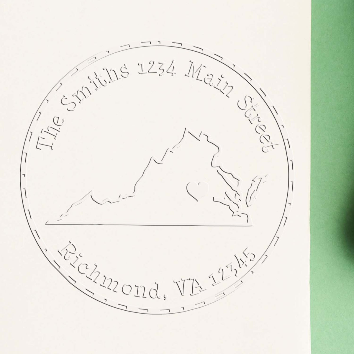 Trodat State Love Desk Handcrafted VA State return address embosser seal stamp in use, showing engraved Virginia map and "Love" design.