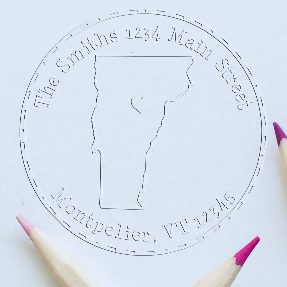 Clear round acrylic stamp seal with Vermont outline and heart for The Smiths, 1234 Main St, Montpelier, VT 12345.