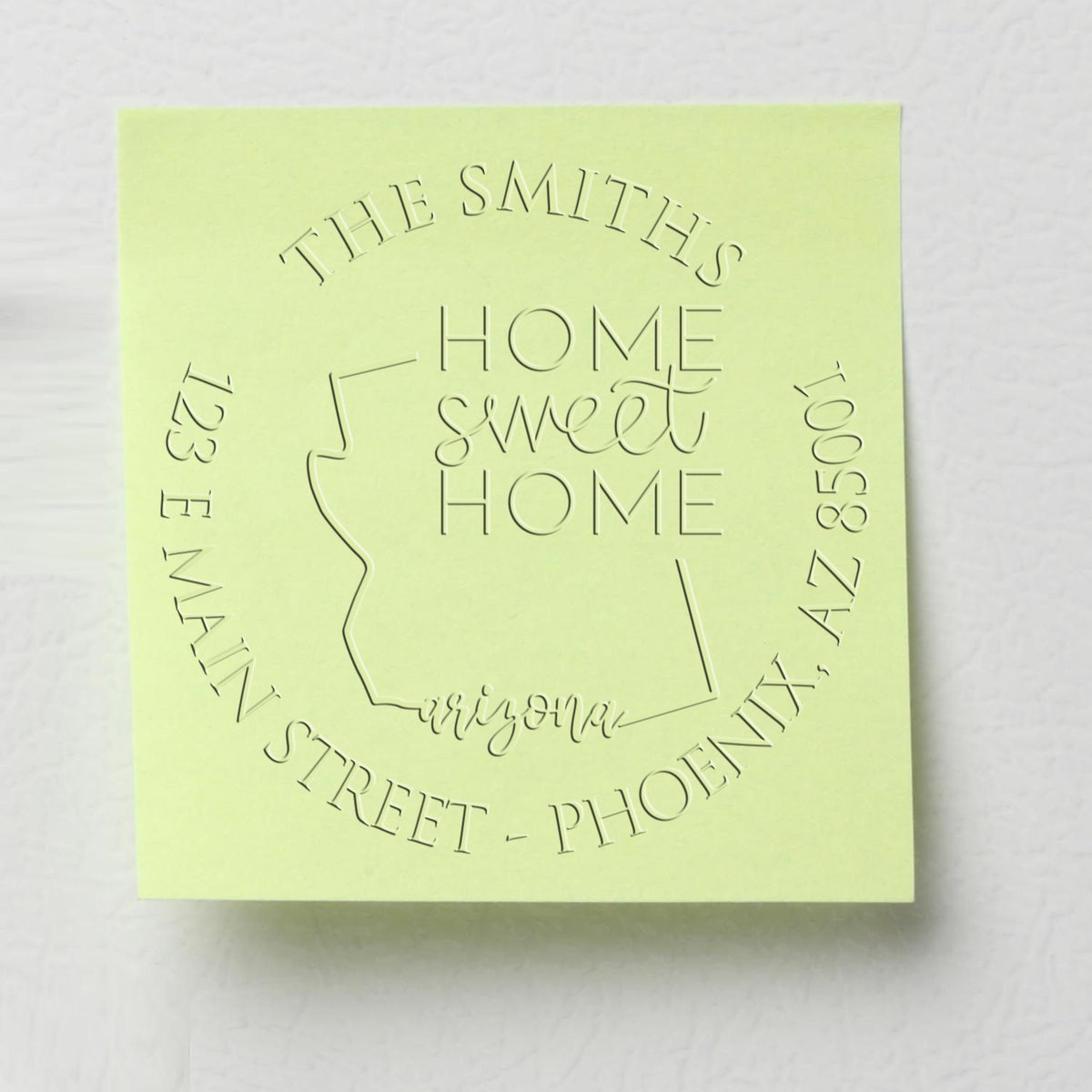Shiny Round AZ Soft Personalized Mailing Address Seal Stamp Embosser with state love design in use.