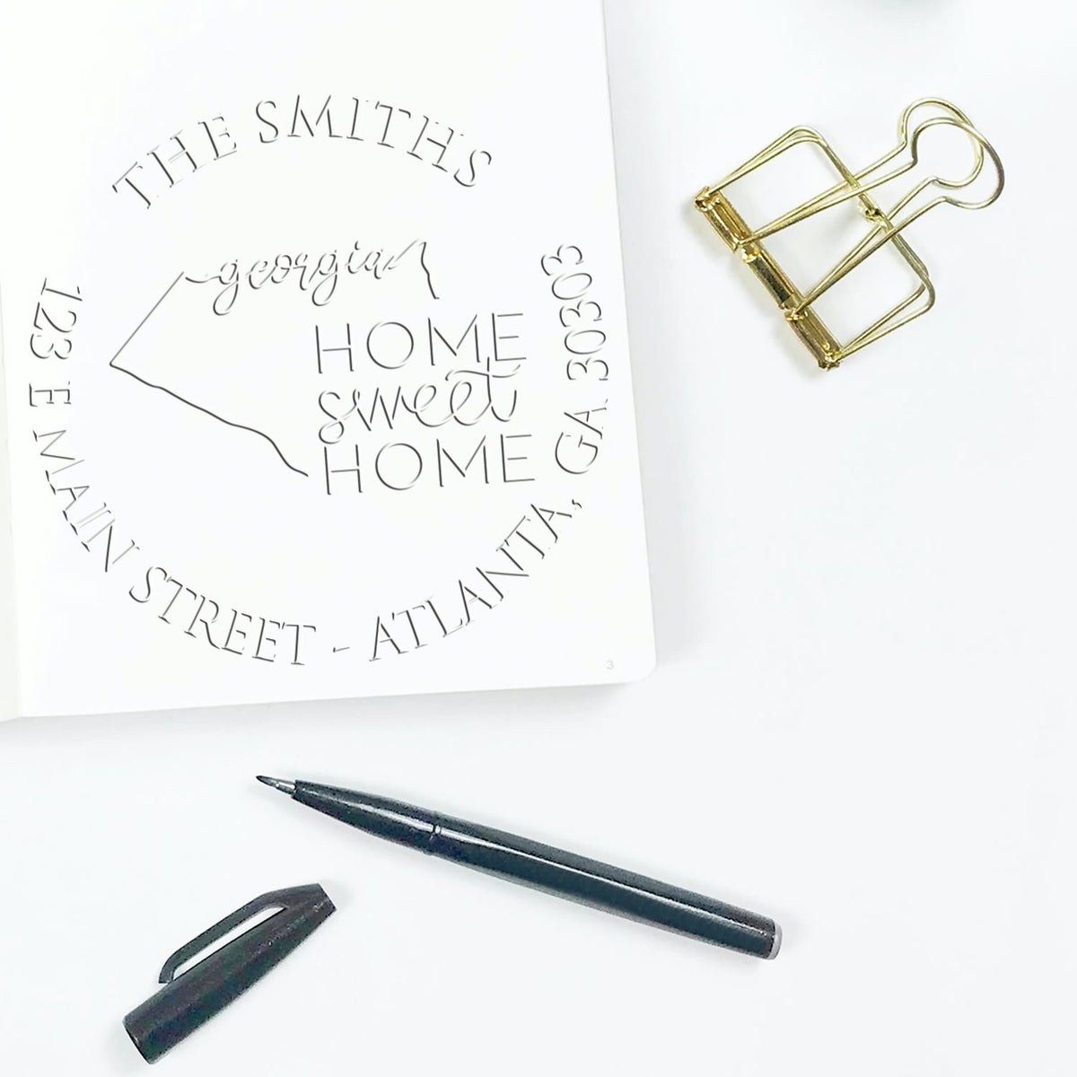 Shiny Round GA Soft Personalized Mailing Address Seal Stamp featuring a state love design in use on mailing materials.
