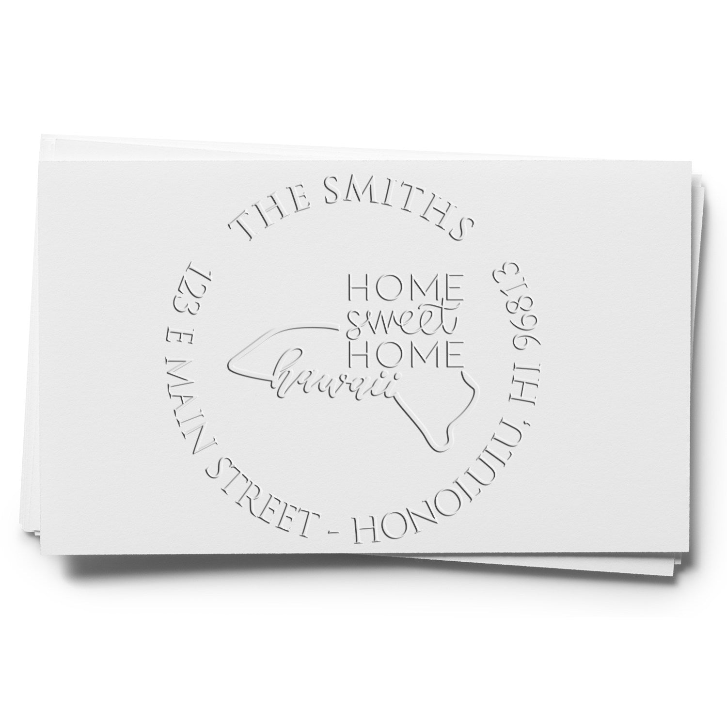 White embossed custom stamp seal with The Smiths, Home Sweet Home Hawaii, and circular address text on stacked cards.
