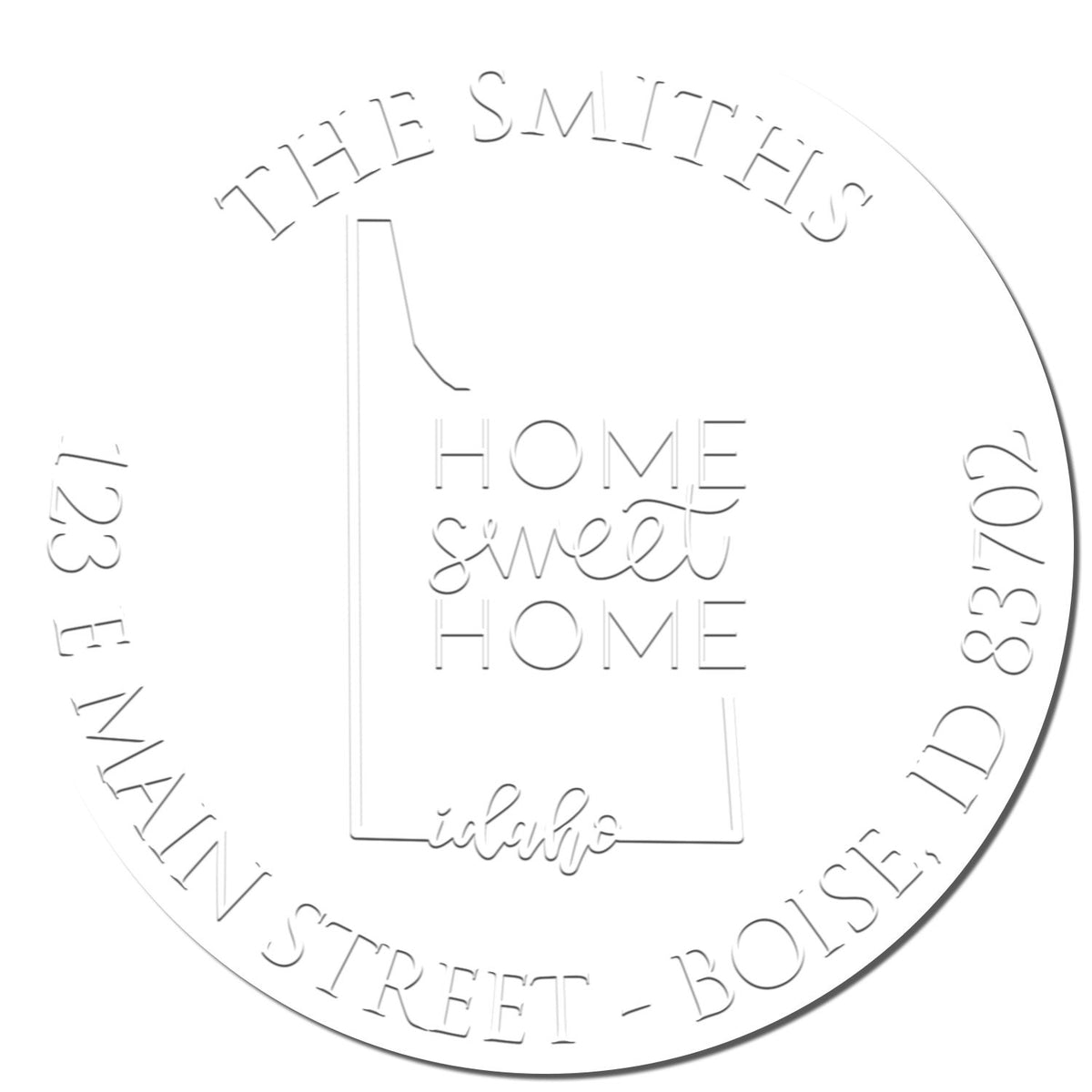 Close-up of Shiny Round ID Soft Personalized Return Embosser Seal with an enlarged imprint, featuring a state love design.