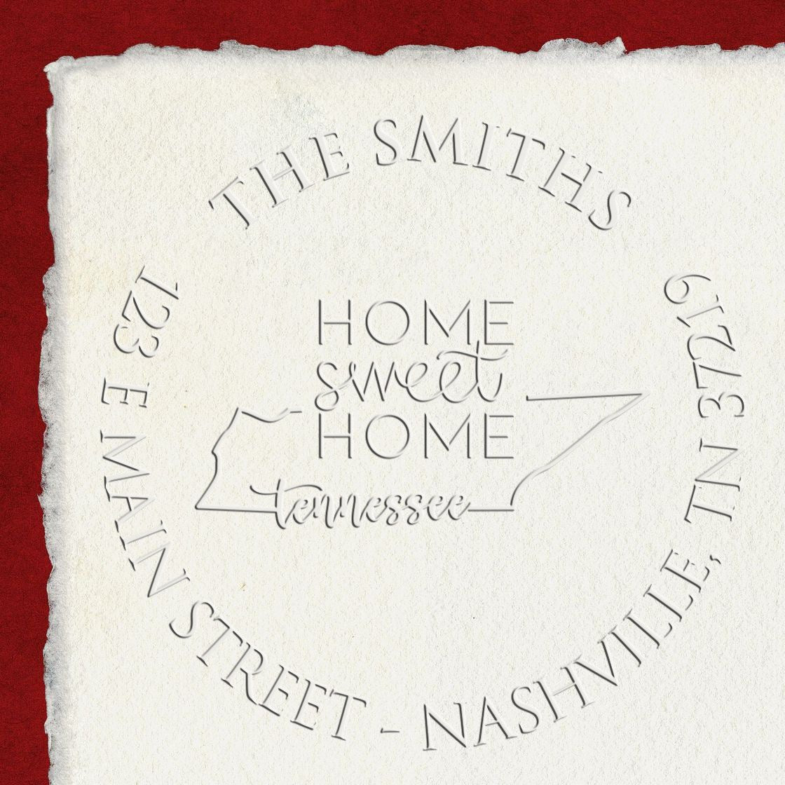 Custom embossed stamp seal on white paper with red background, reading Home Sweet Home Tennessee and The Smiths around the edge.