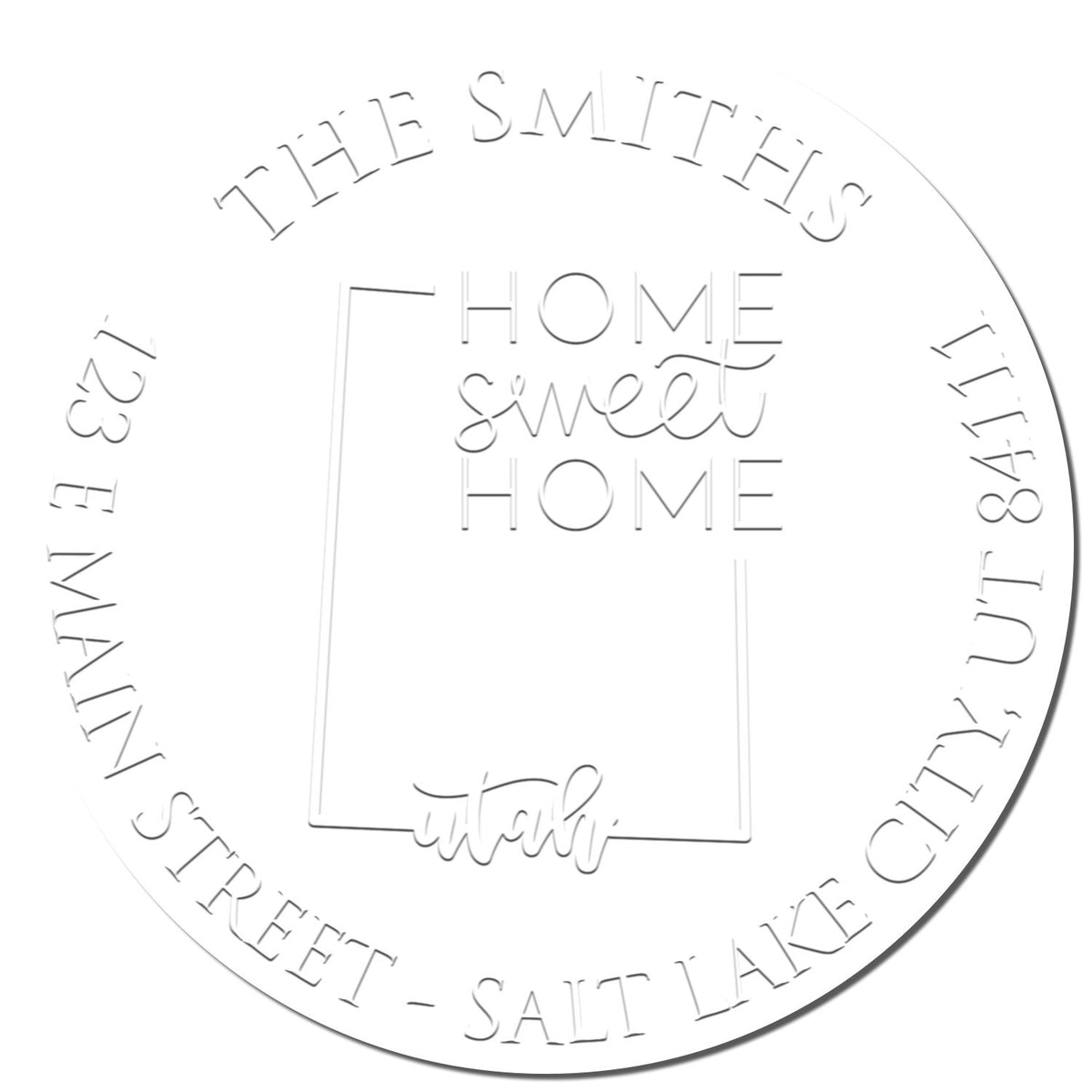 Close-up of Shiny Round UT Soft Personalizable Address Embosser Seal Stamp with enlarged state imprint on paper.