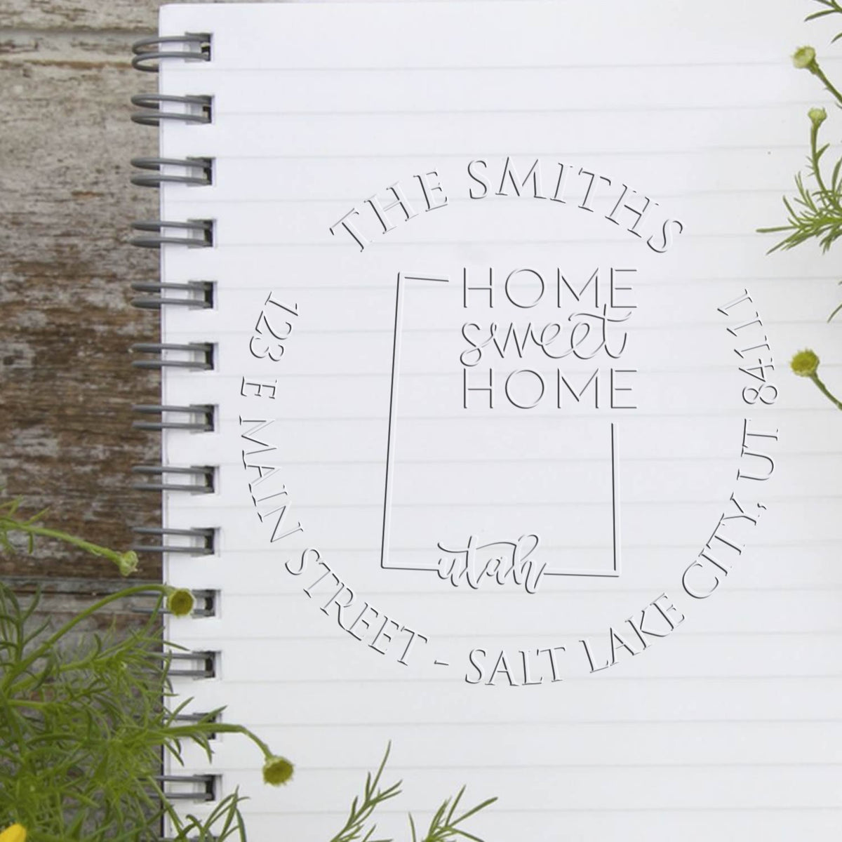 Shiny Round UT Soft Personalizable Address Embosser Seal Stamp with state love design in use.