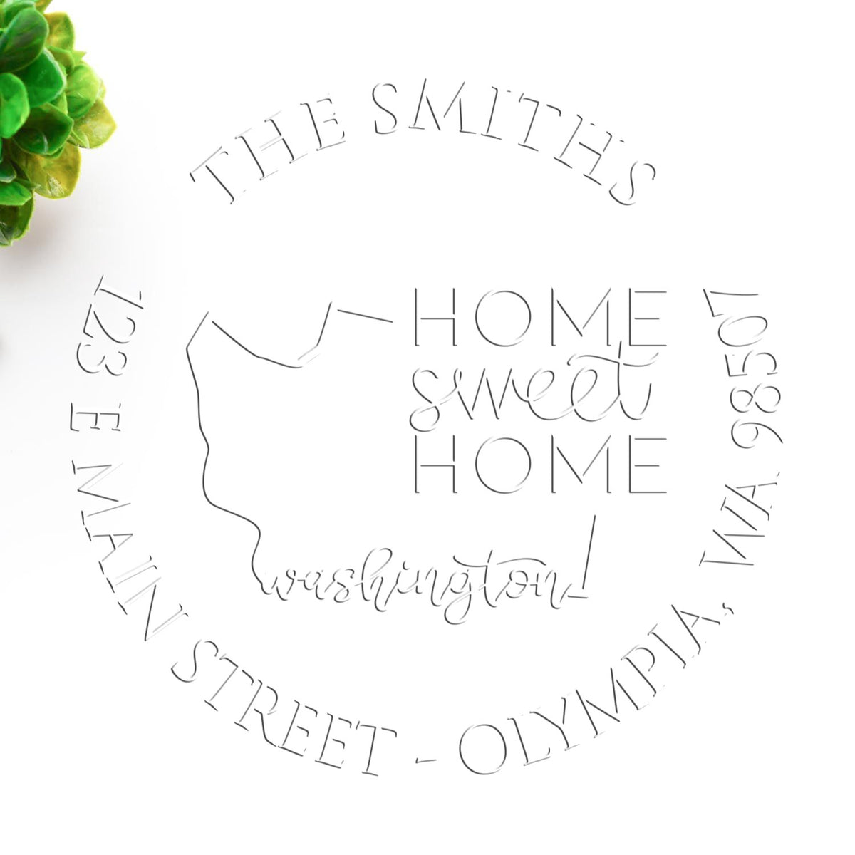Shiny Round WA Soft Personalizable Home Address Embosser with state love design in use on paper.