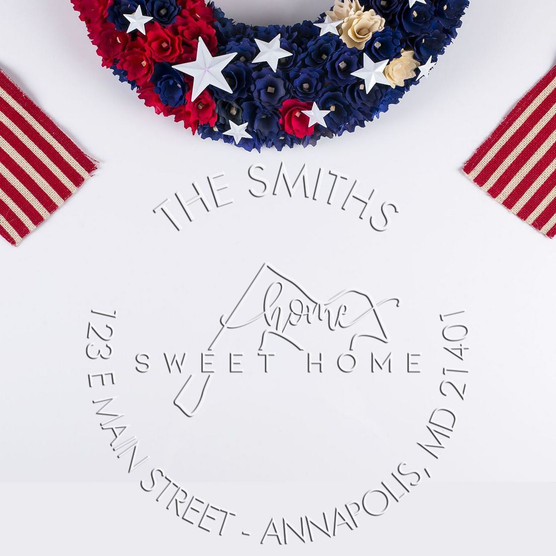 Custom stamp and seal with patriotic red, white and blue star wreath and embossed Smiths Sweet Home address.